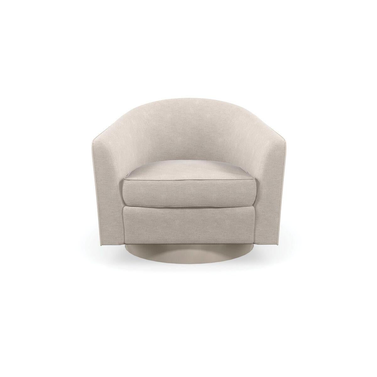 This softly curved swivel chair introduces a free-flowing, organic style to seating areas. A quilted ginkgo leaf pattern fanning out along the back creates repetition and subtle movement, accented by a cream-colored contrast welt and plinth base