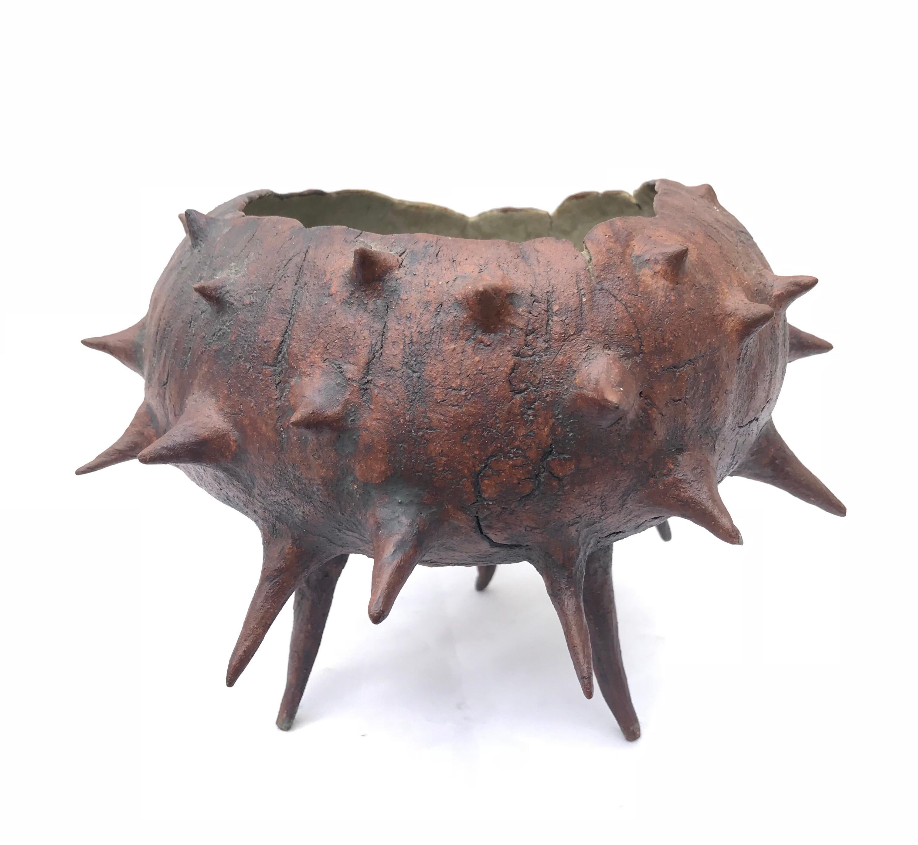 A studio made organic modern bowl of thorns. Signed with a singular letter 