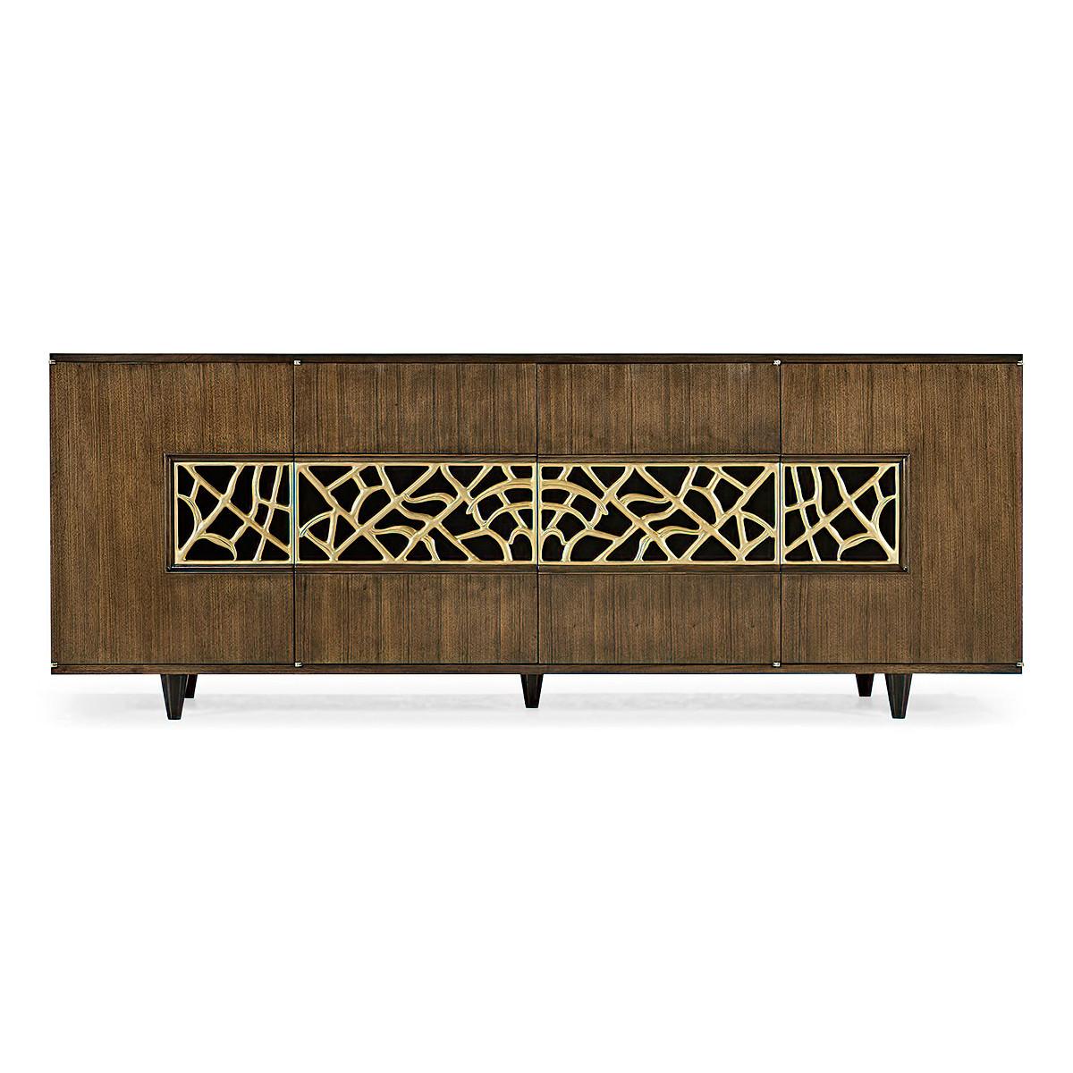 Organic modern walnut media cabinet, constructed of American walnut with a hand-rubbed lacquer finish. The organic decorative grill is cast brass with a soft, satin brass finish. 

The top features a black glass insert for serving and the interior