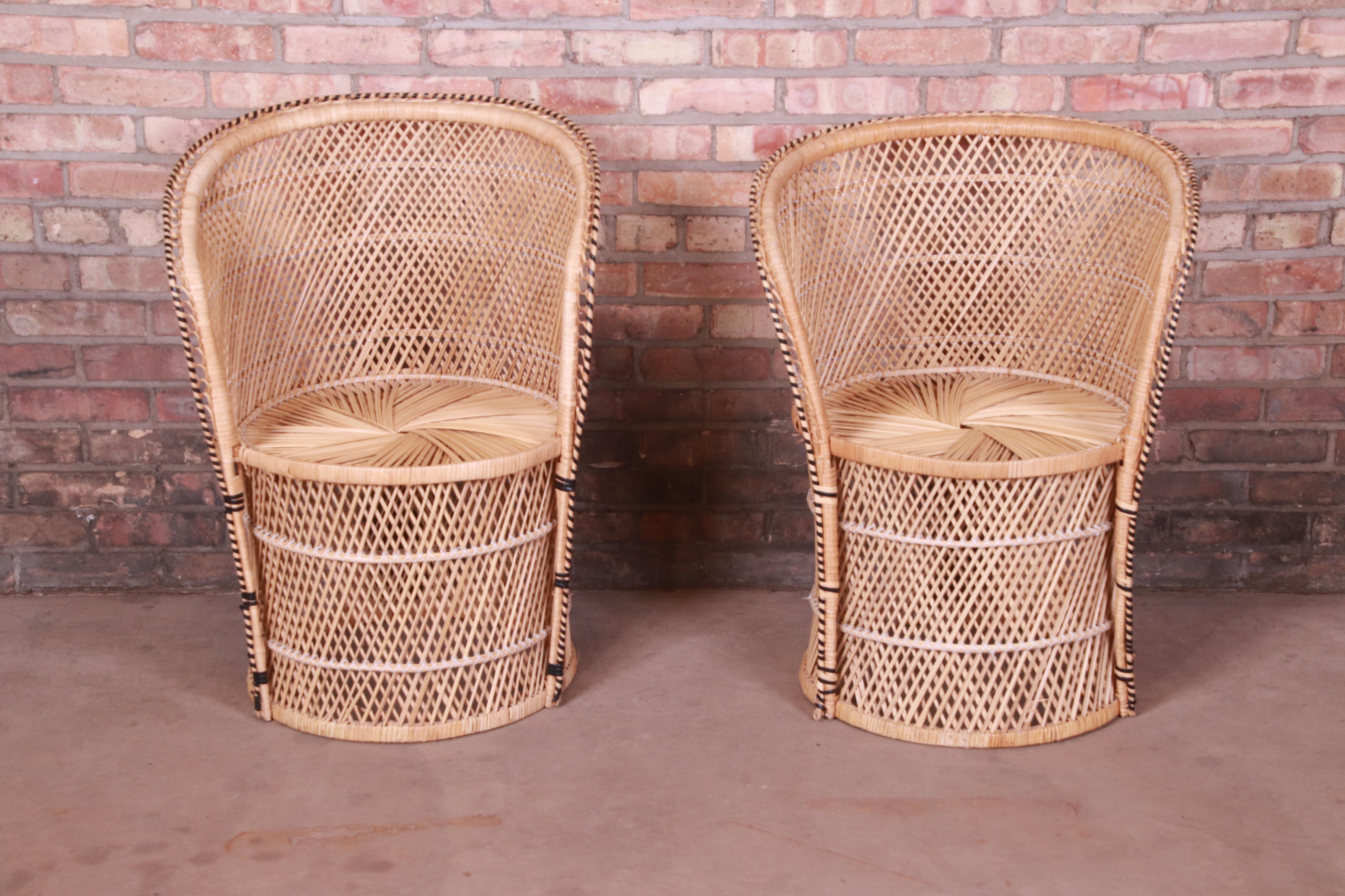A gorgeous pair of organic modern club chairs,

circa 1970s

Wicker and rattan, with plastic binding.

Measures: 24