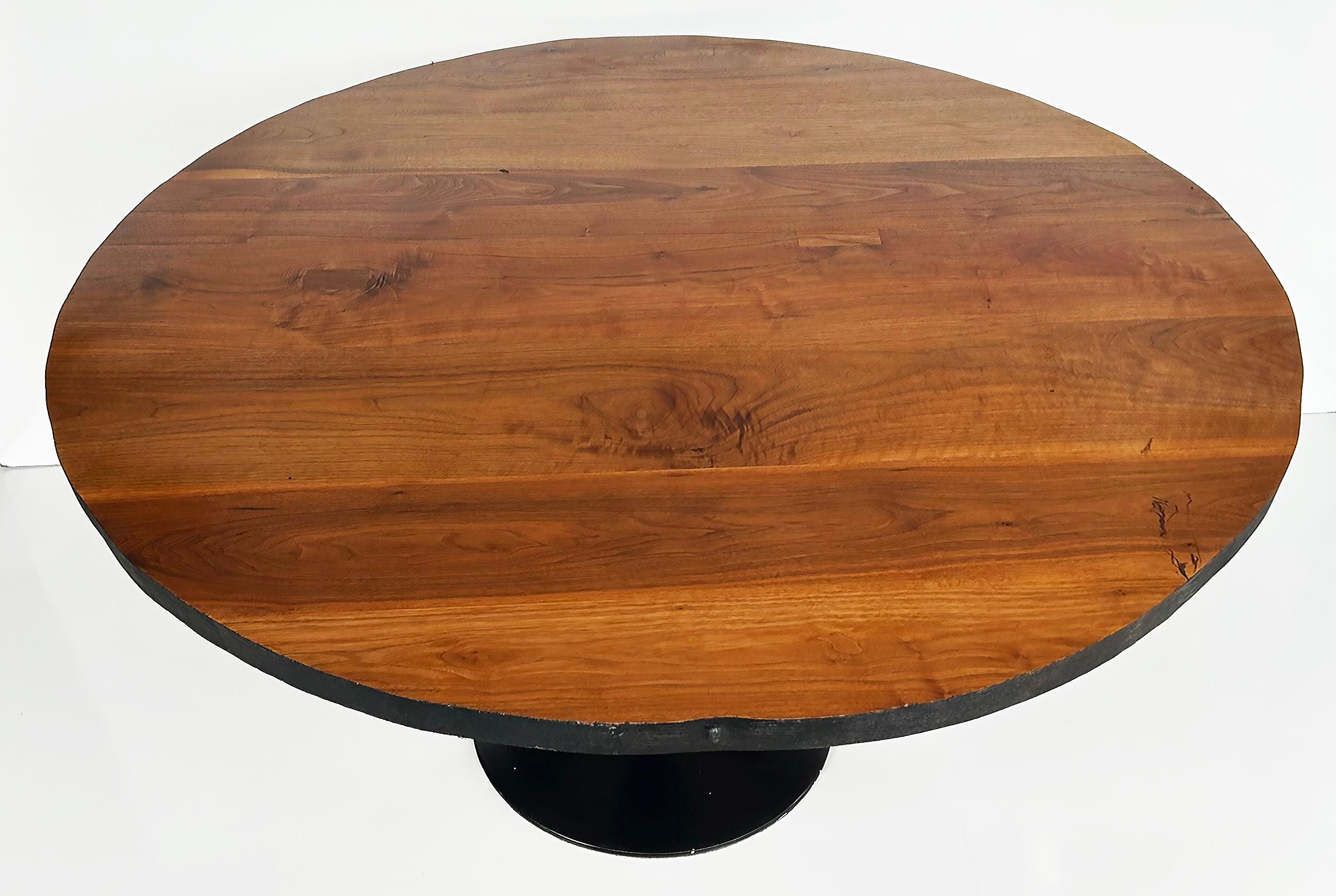 Organic Modern Industrial Tulip Dining Table with Recycled Wood Top

Offered for sale is a round, organic modern industrial dining table acquired from Organic Modernism in Brooklyn, NY.  This substantial, large round dining table has a black