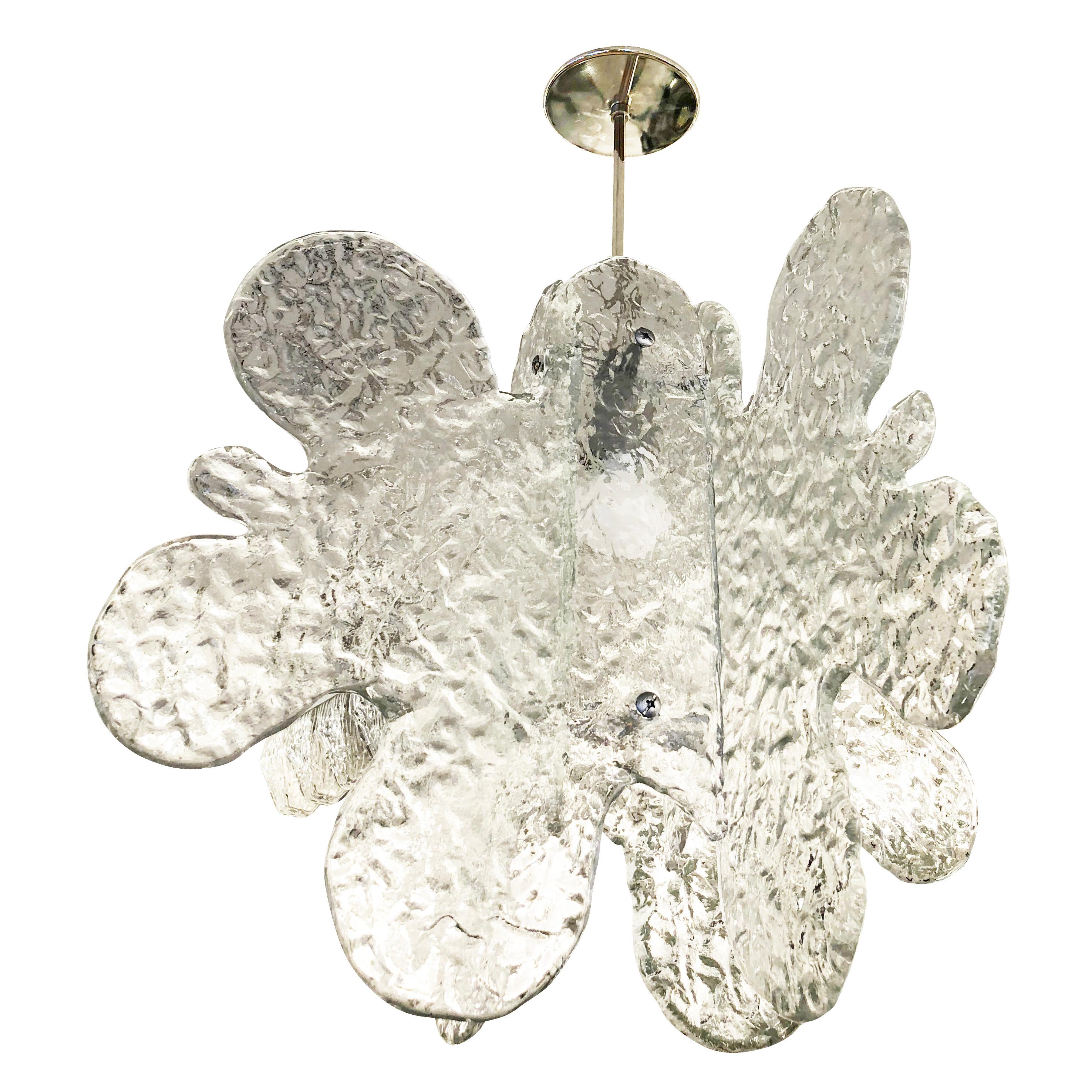 Murano glass pendant made by Mazzega in the 1960s featuring four organically shaped and textured glass slabs joined by a central sliver lacquered frame. Nickel stem and canopy. Holds one Edison socket. Stem length can be adjusted as