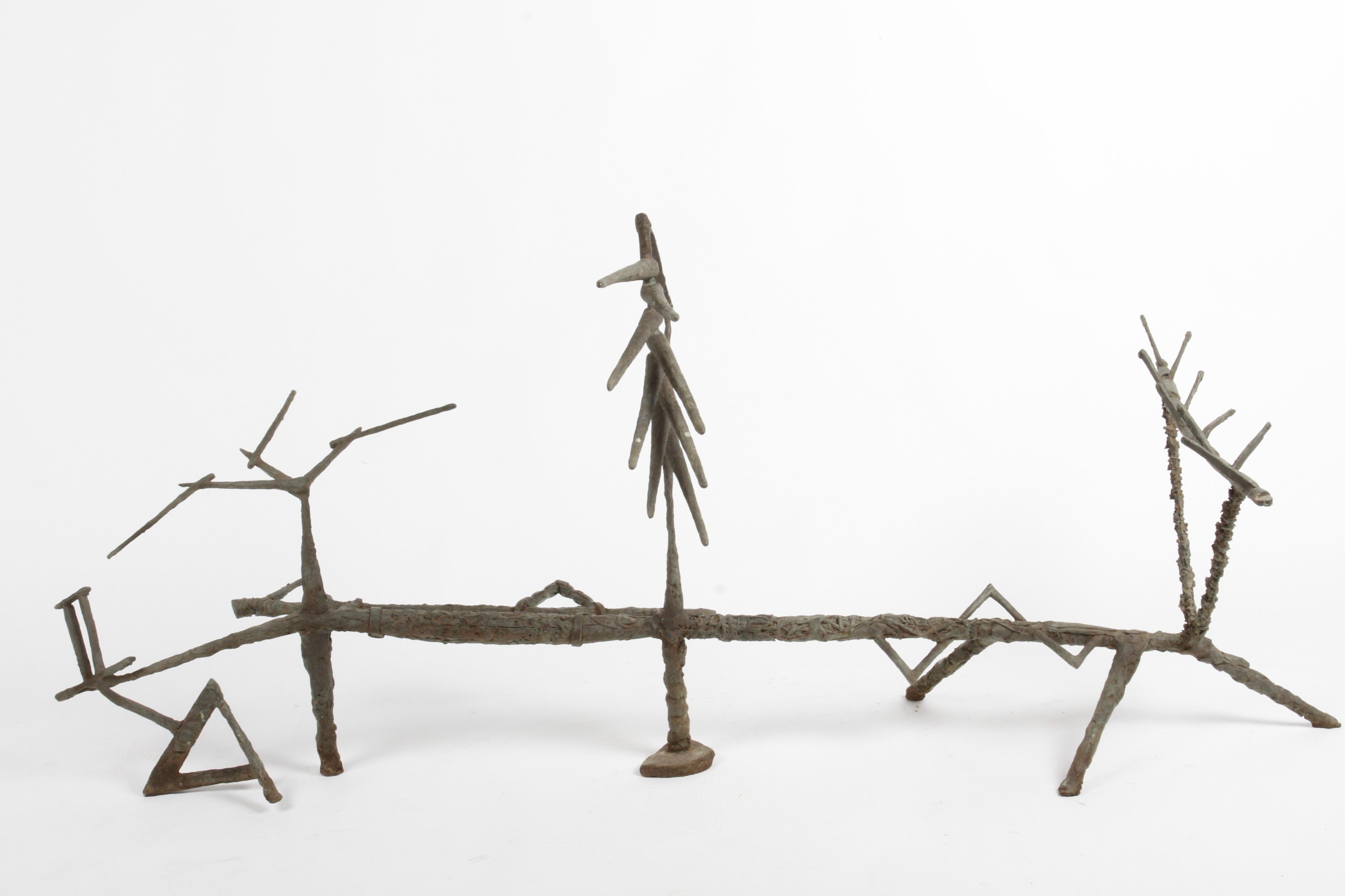 Organic form bronze garden or yard sculpture by California Sculptor Tim Doyle. Influenced by Alberto Giacometti, with use of African tribal motifs and brutalist textures. This sculpture was cast using the lost wax method while Tim was at Southern