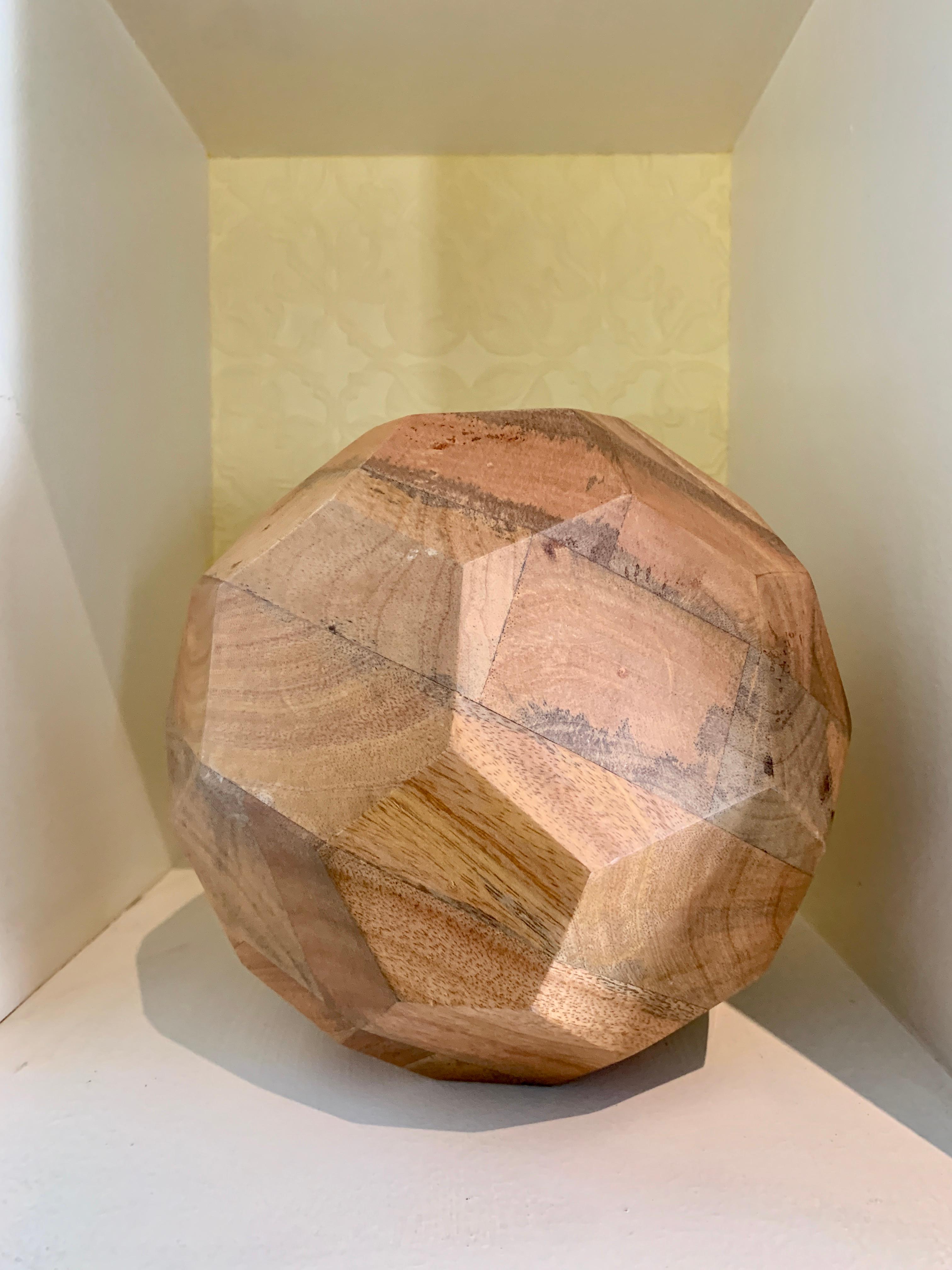 Organic sculpted handcut wooden sphere, a great decorative addition to any shelf or table, a compliment as a bookend or light enough to be a substantial paper weight. Solid wood and finely cut with just enough patina to give your space character.