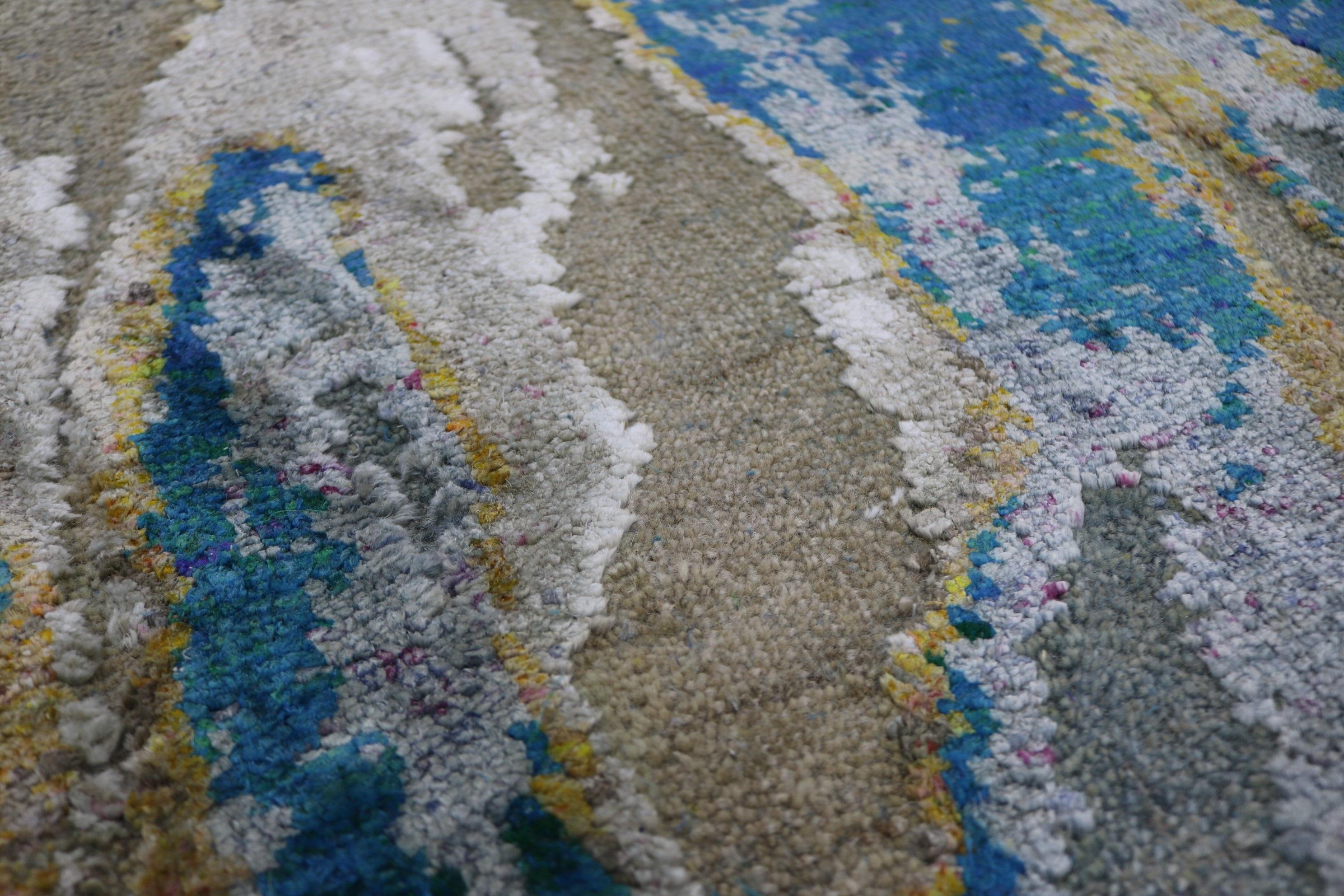 The Odyssey collection a breakthrough, three dimensional and multi textural rug collection, inspired by NASA imagery. Distressed wool and natural silk are hand knotted to create three levels of visual and tactile finery. The collection pairs vintage