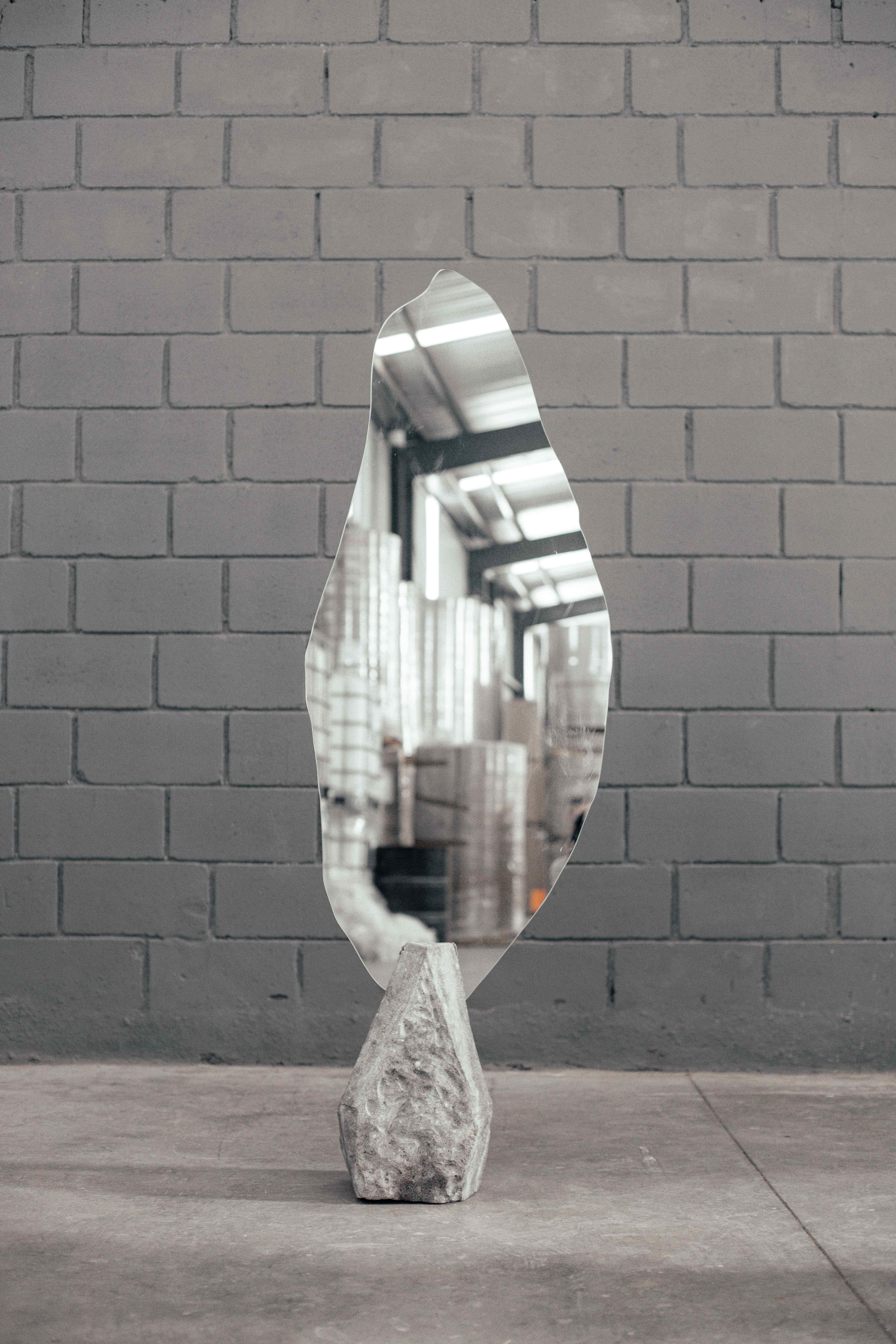 Organic Shape Mirror with Grey Stone Base in Center by Andres Monnier