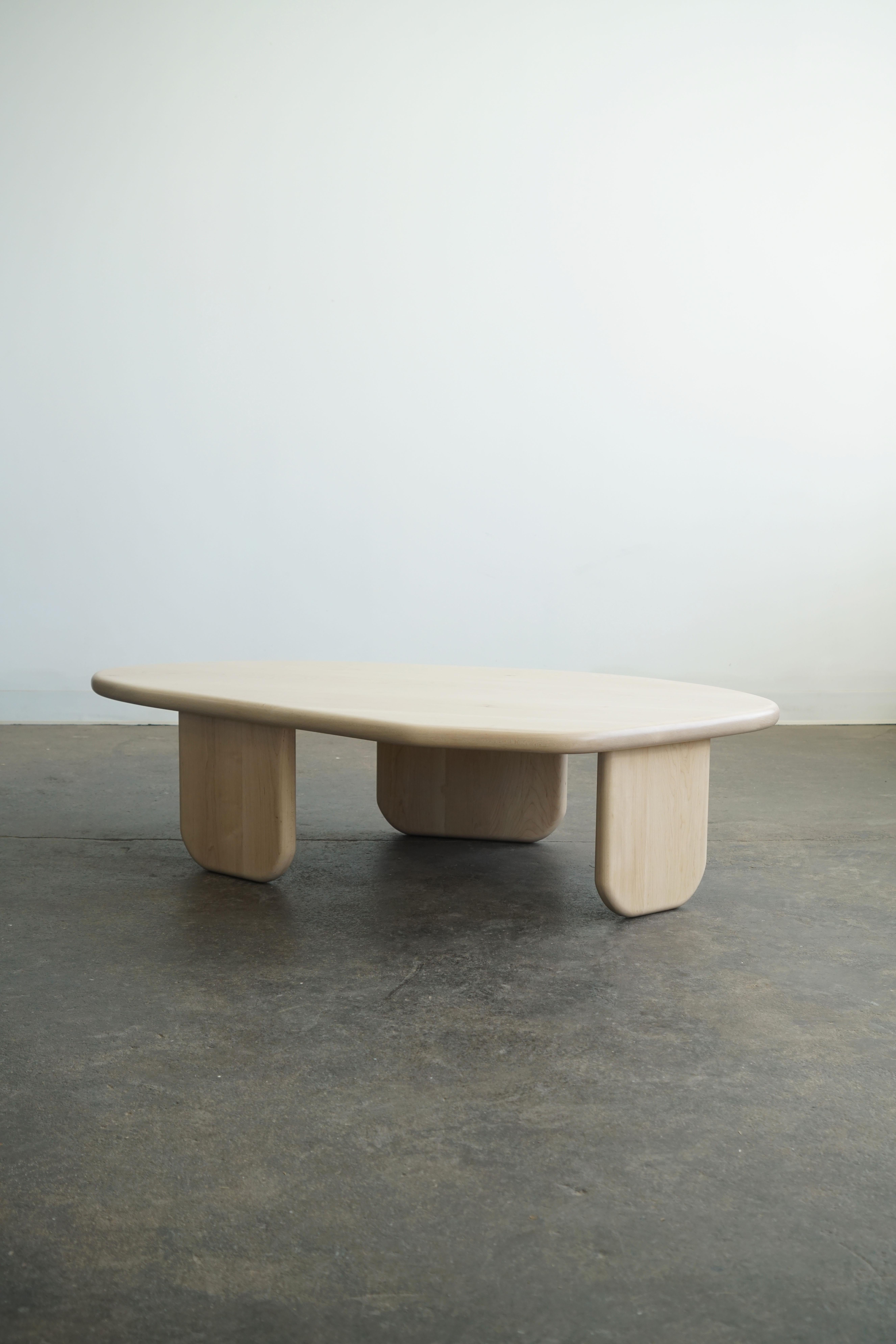 Organic shaped coffee table by Last Workshop.
in natural maple.

New, and made-to-order
Standard size: 58”L x 32”W x 15”H

Customers can also choose from:
Wood species, finishes, and overall dimensions.

The table has three different sized legs that