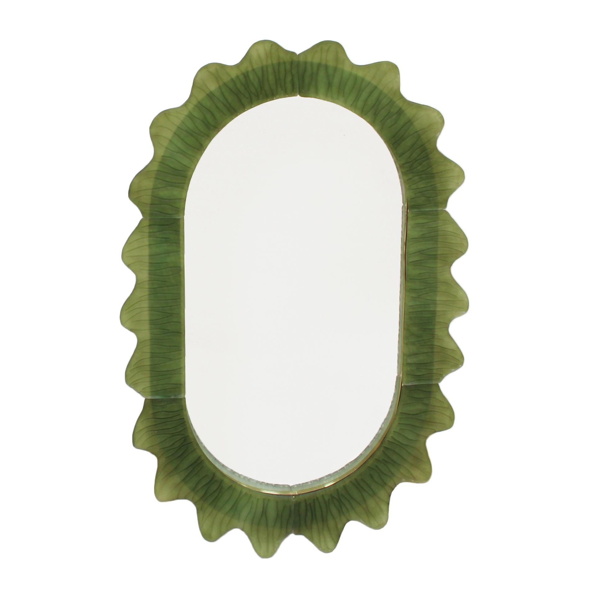 Mirror with a wooden structure featuring a brass profile and a front made of handcrafted Murano glass. Current production from Murano, Italy. 

This mirror is the perfect choice for interior design projects, seamlessly integrating into both modern