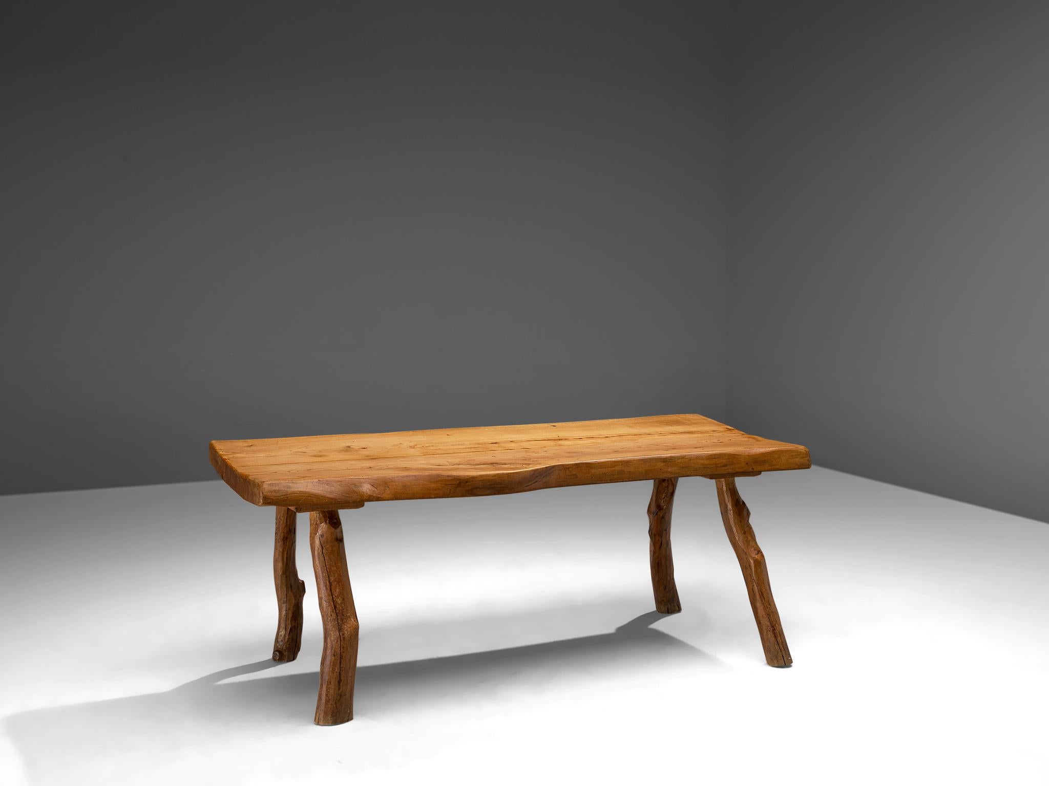 Dining table, oak, Europe, 1960s.

Oak wooden dining table that features robust design with organic elements. The bulky table is executed in solid oak that developed a nice, rustic patina from age and use. The design features a thick table top