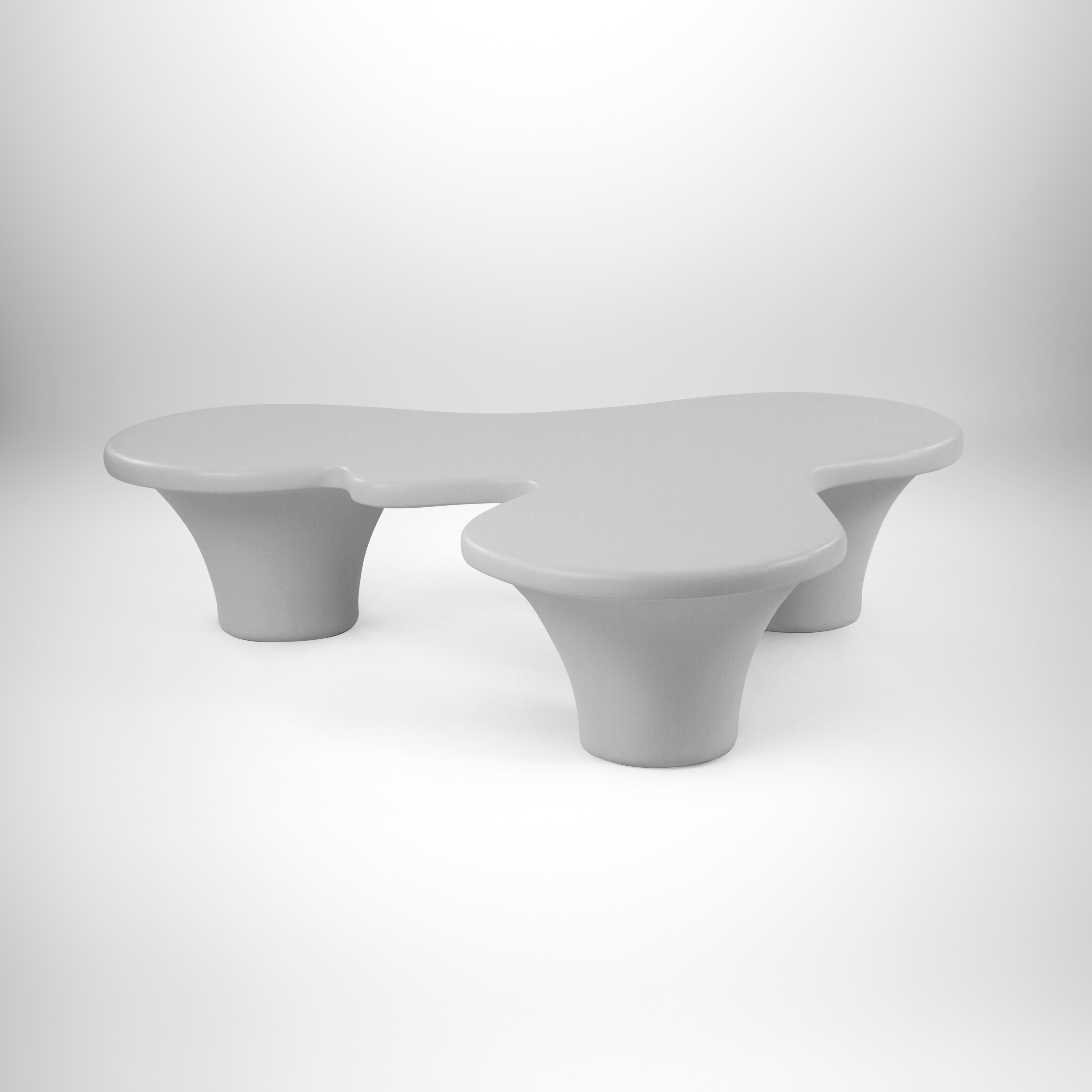 Organic-Shaped Weather-Resistant Fiberglass Outdoor coffee table - Grey.
Not just sublime but also a very practical outdoor coffee table. Its cloud-inspired surface area allows for maximum coverage and reach. Soft edges and receding legs make it
