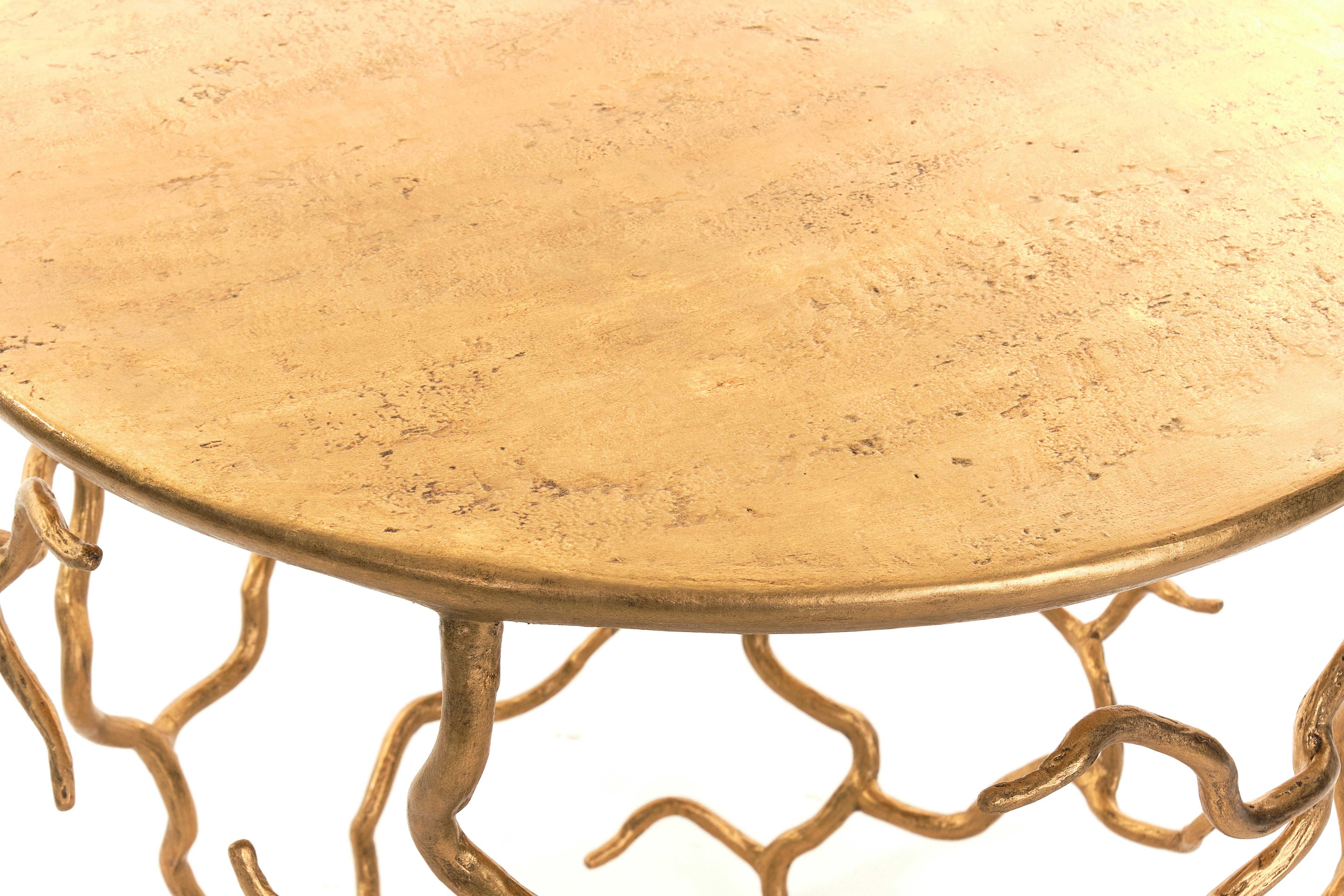 Organic forms and natural motifs. The Etna side table is individually hammered and hand formed. Each piece has been skillfully finished to resemble the texture of tree bark. The Top also hand-sculpted. Also available in Forest Brown Finish. 