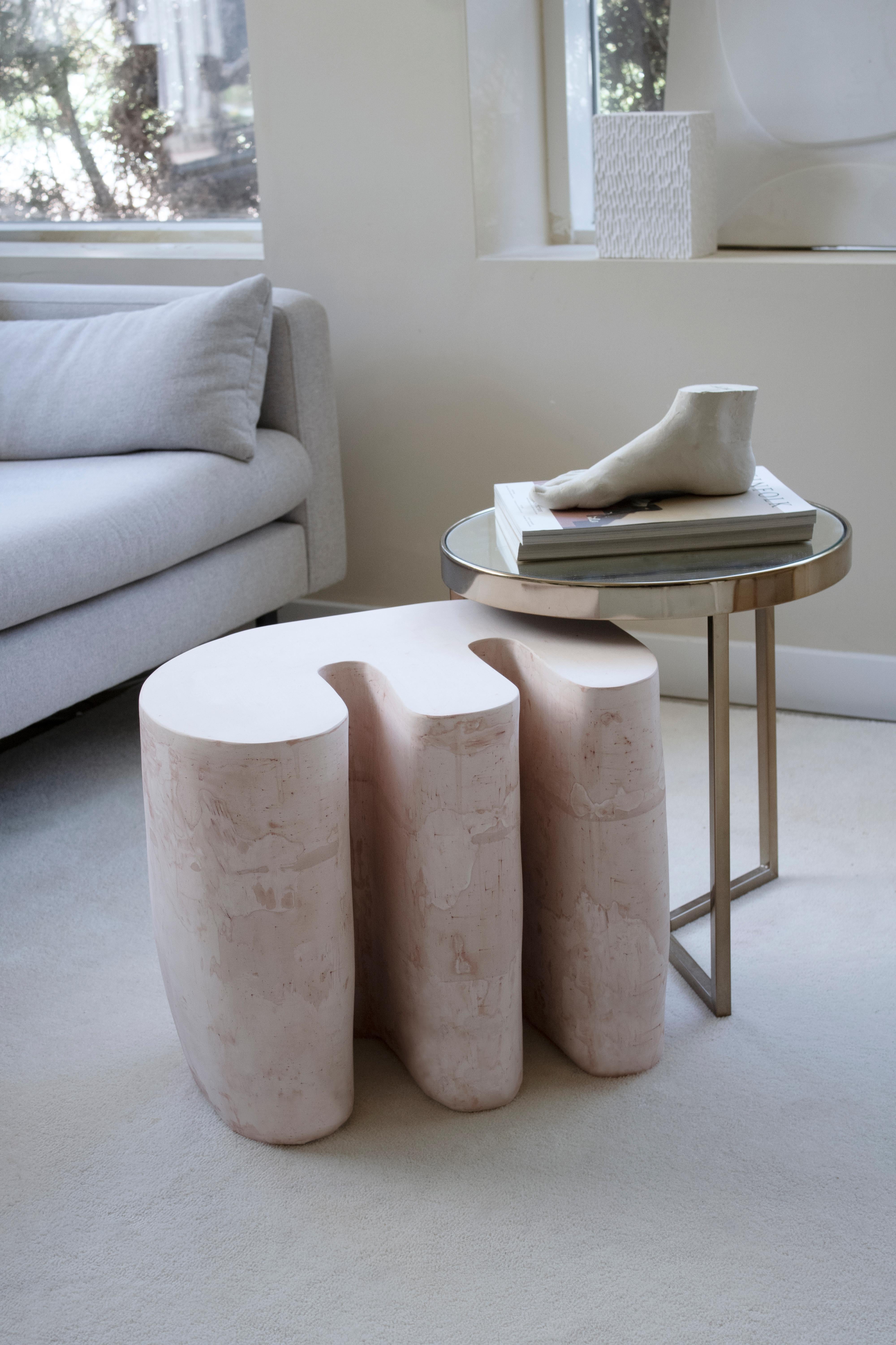 The Organic Side Table No.001 is a handmade gypsum side table part of the Forms collection. Its cast gypsum construction, hand-carved detailing, and customizable color options ensure that each piece is unique, creating a special allure that