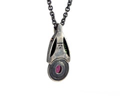 Organic Silver and 18 Karat Rose Gold Cross Pendant with Red and Green Garnets