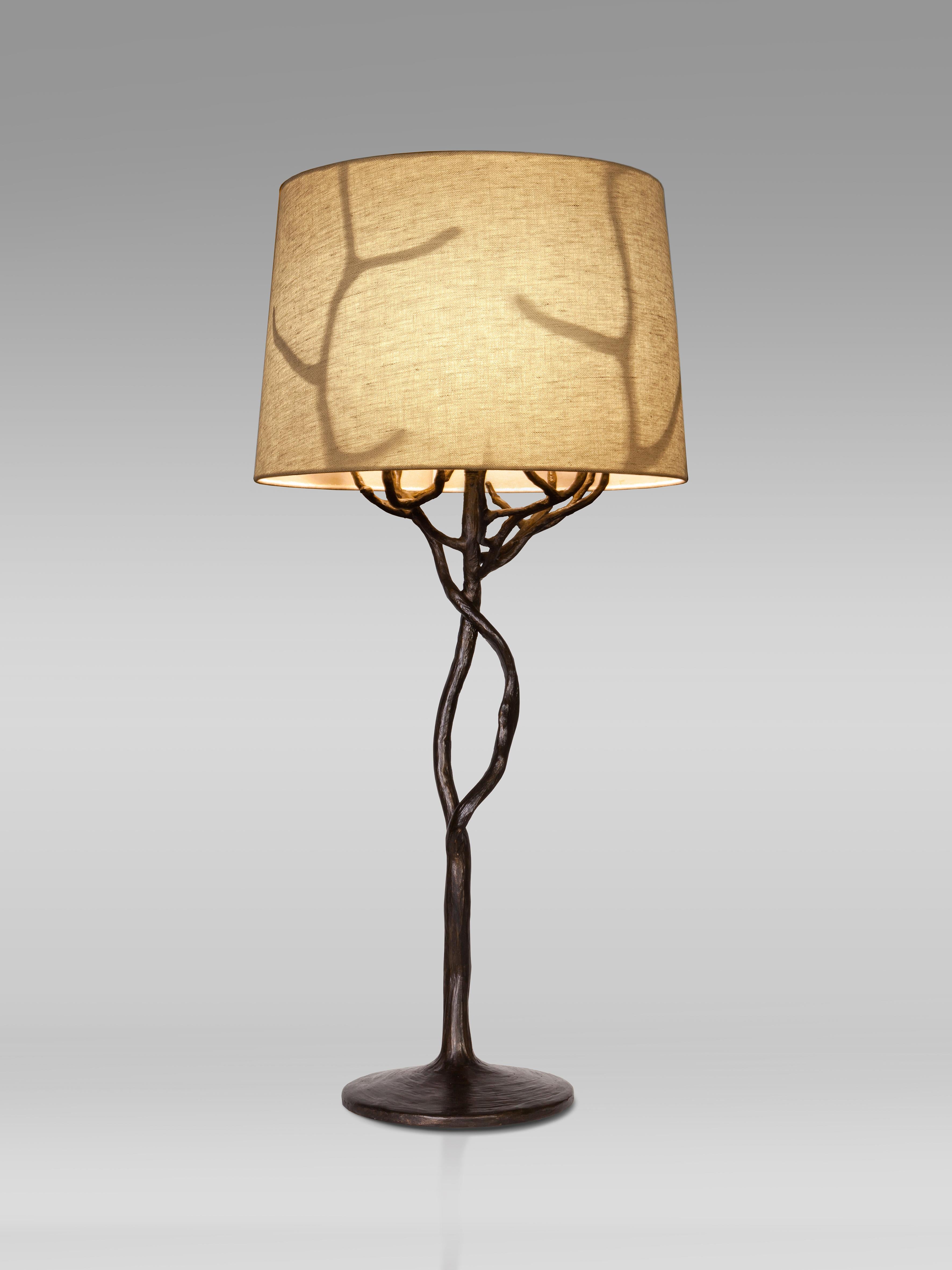 Organic forms and natural motifs. The Etna table lamp is individually hammered and hand formed. Each piece has been skillfully finished to resemble the texture of tree bark. Also available in Antique Gold Finish. Custom size upon request.


Linen