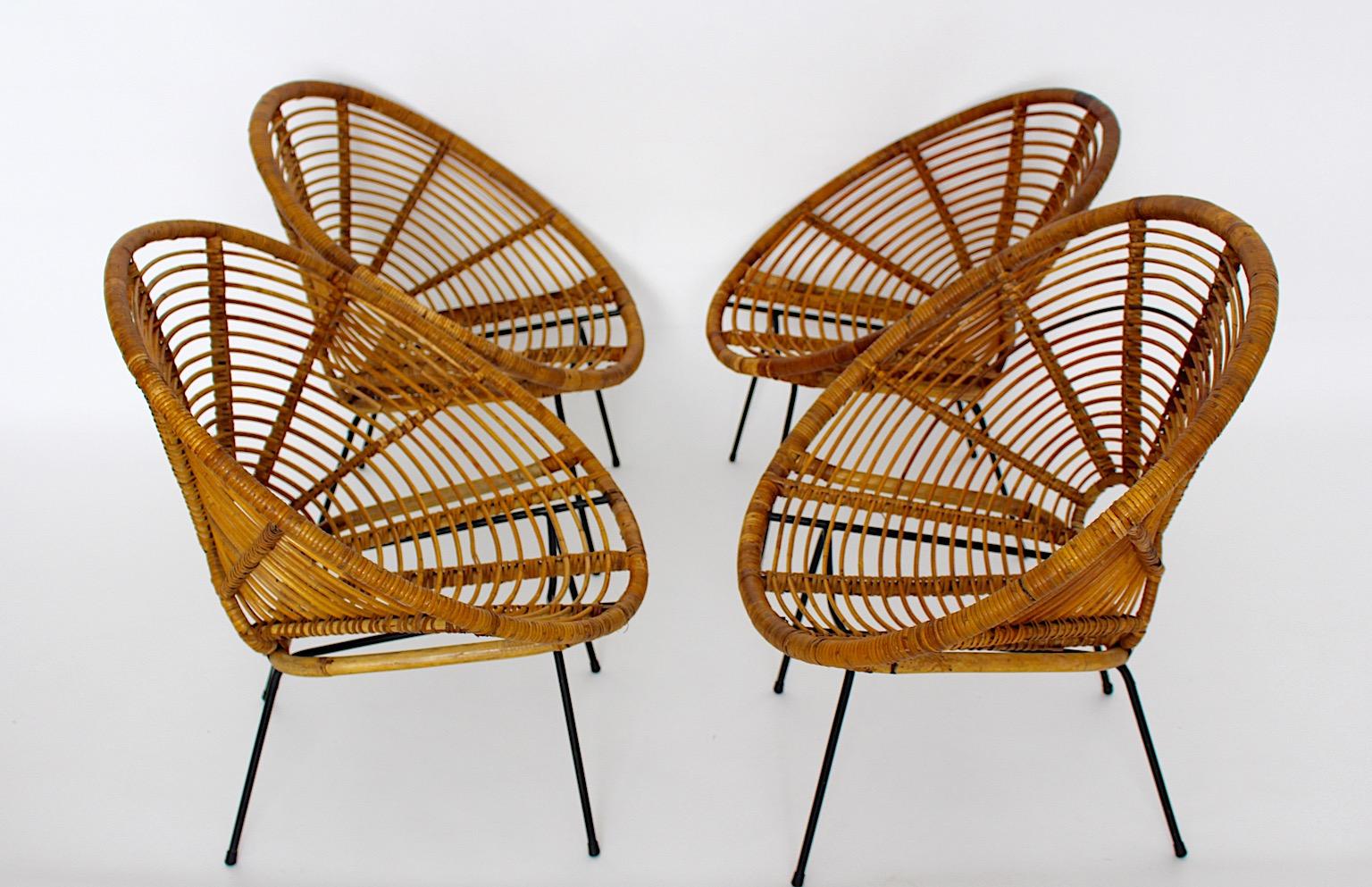 Mid-20th Century Organic Vintage Riviera Style Rattan Dining Chairs Patio Chairs Four 1950 France For Sale