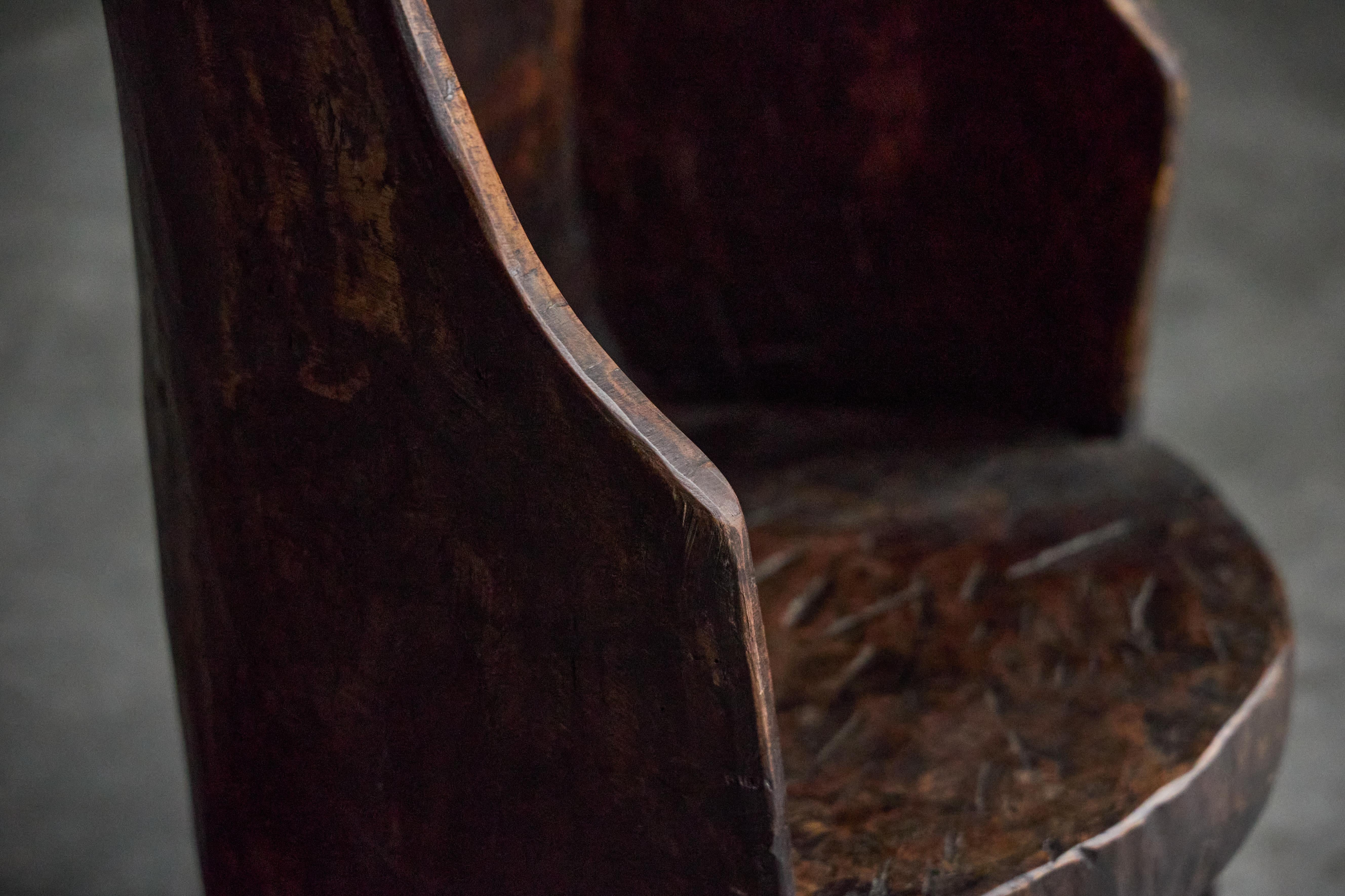 This one-of-a-kind folk art chair from France embodies the wabi-sabi philosophy, celebrating the beauty of natural imperfection. Crafted with remarkable woodworking, its rich patina tells a story of age and graceful wear. This rustic piece brings