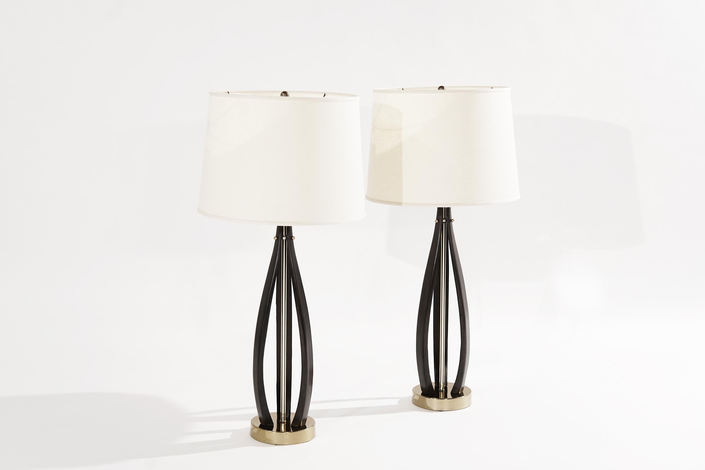 Stylish pair of bent walnut and bronze table lamps. Walnut fully restored to its original espresso finish. New off-white linen shades included. completely rewired and ready for use.

Other designers working in the organic style include Adrian