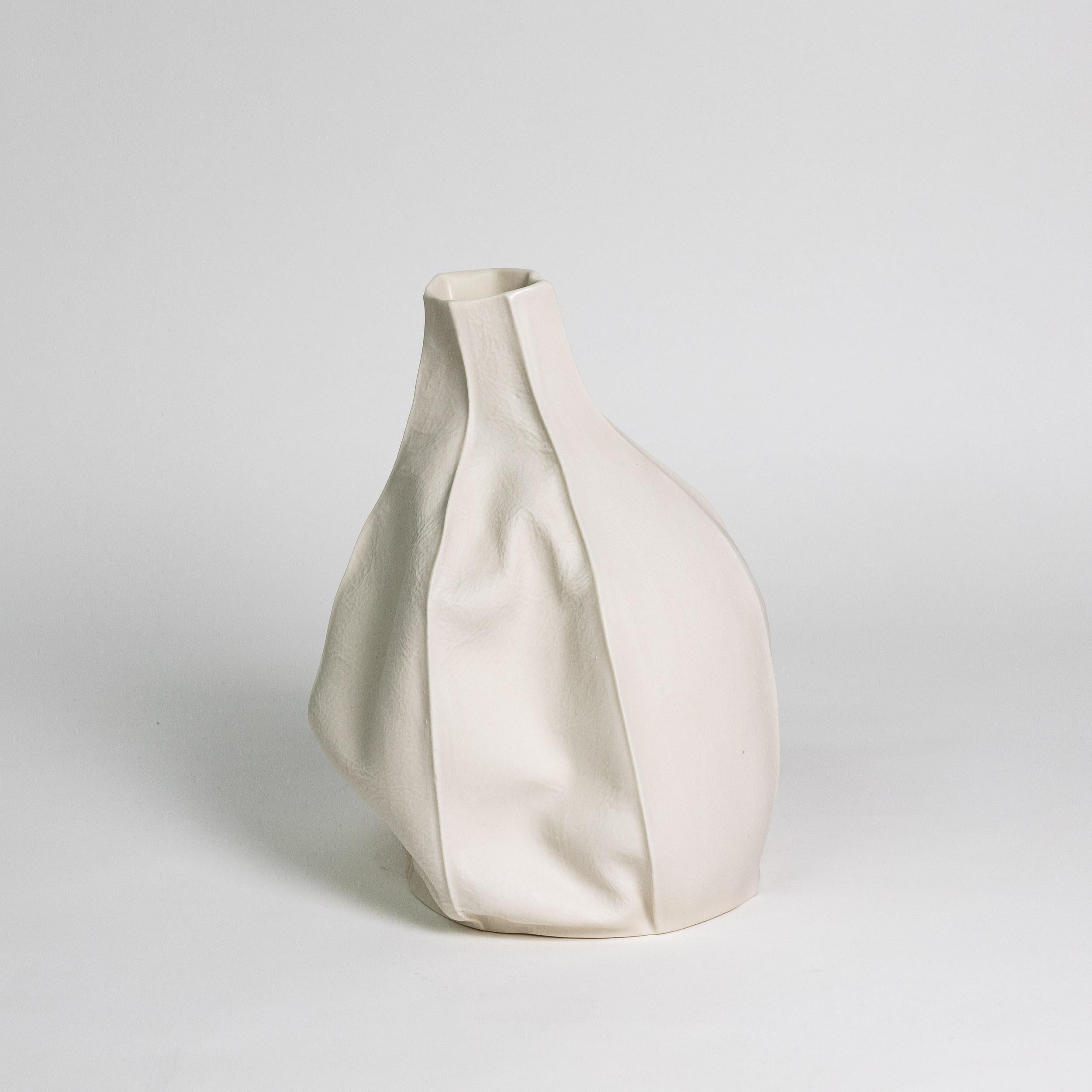 Kawa Vase 10

Organic white ceramic vase with textured raw porcelain exterior surface and clear glazed interior. As a result of the production process each item is one-of-a-kind.

Vases are watertight and will hold water for flower