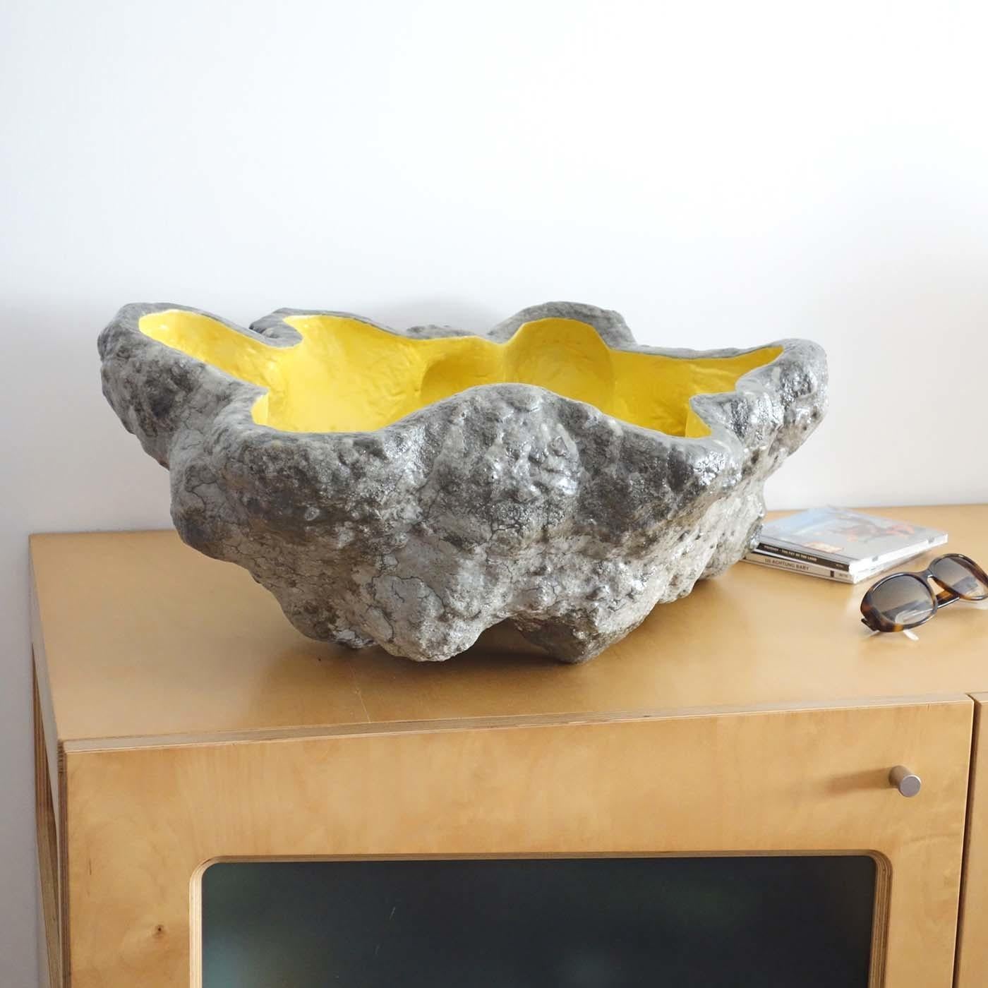 This object is made from lightweight, reinforced concrete. As each item is produced individually without a mould, every piece is unique and one of a kind. Its organic shape is painted and varnished to enhance its form. It can be used as coin tray,