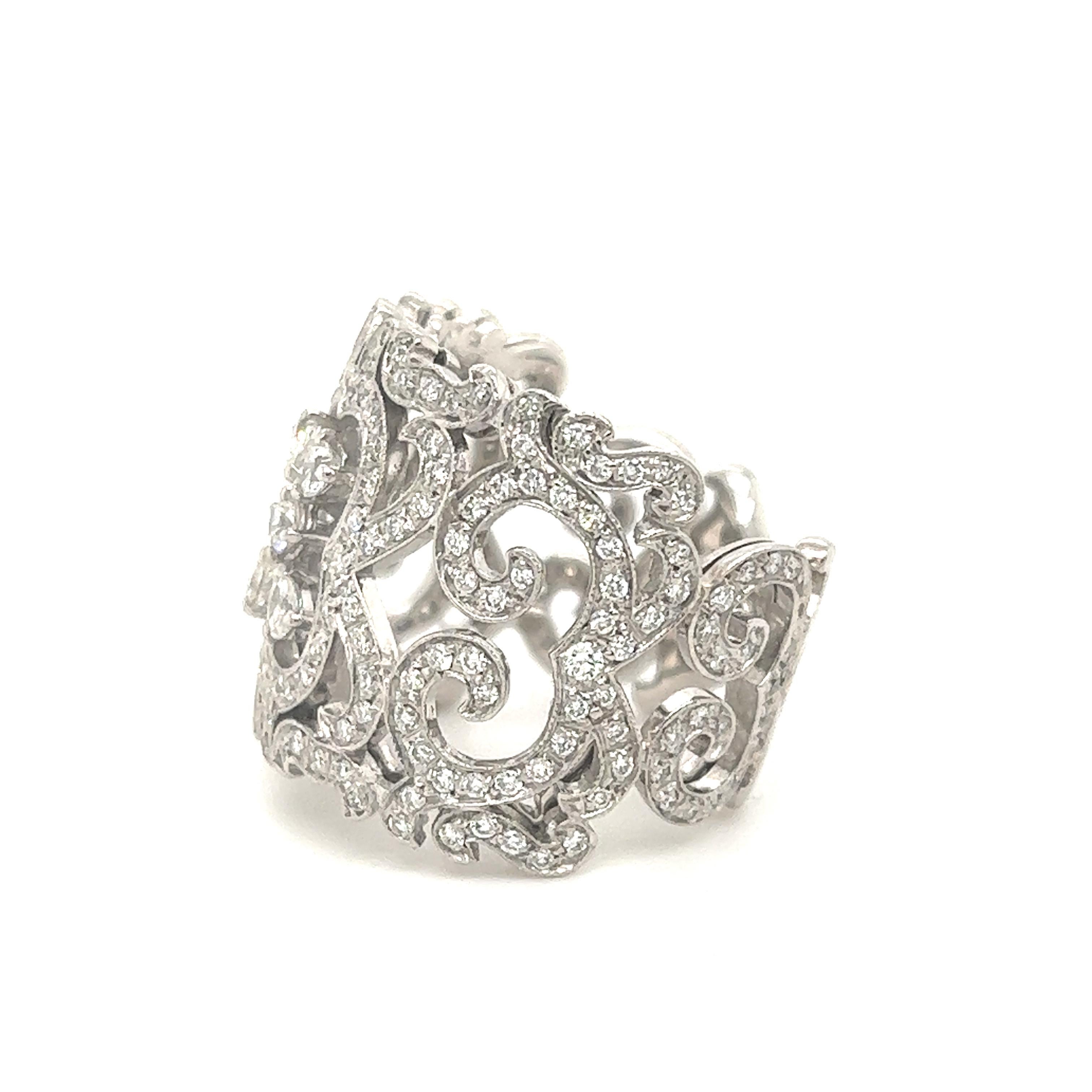 Fantastic ring crafted in 18k white gold. The ring is crafted by designer Orianne Collins. Beautifully detailed with swirling patterns in the metal workings this ring is sure to grab attention when worn. The rings set with over 2.75 tcw. of round