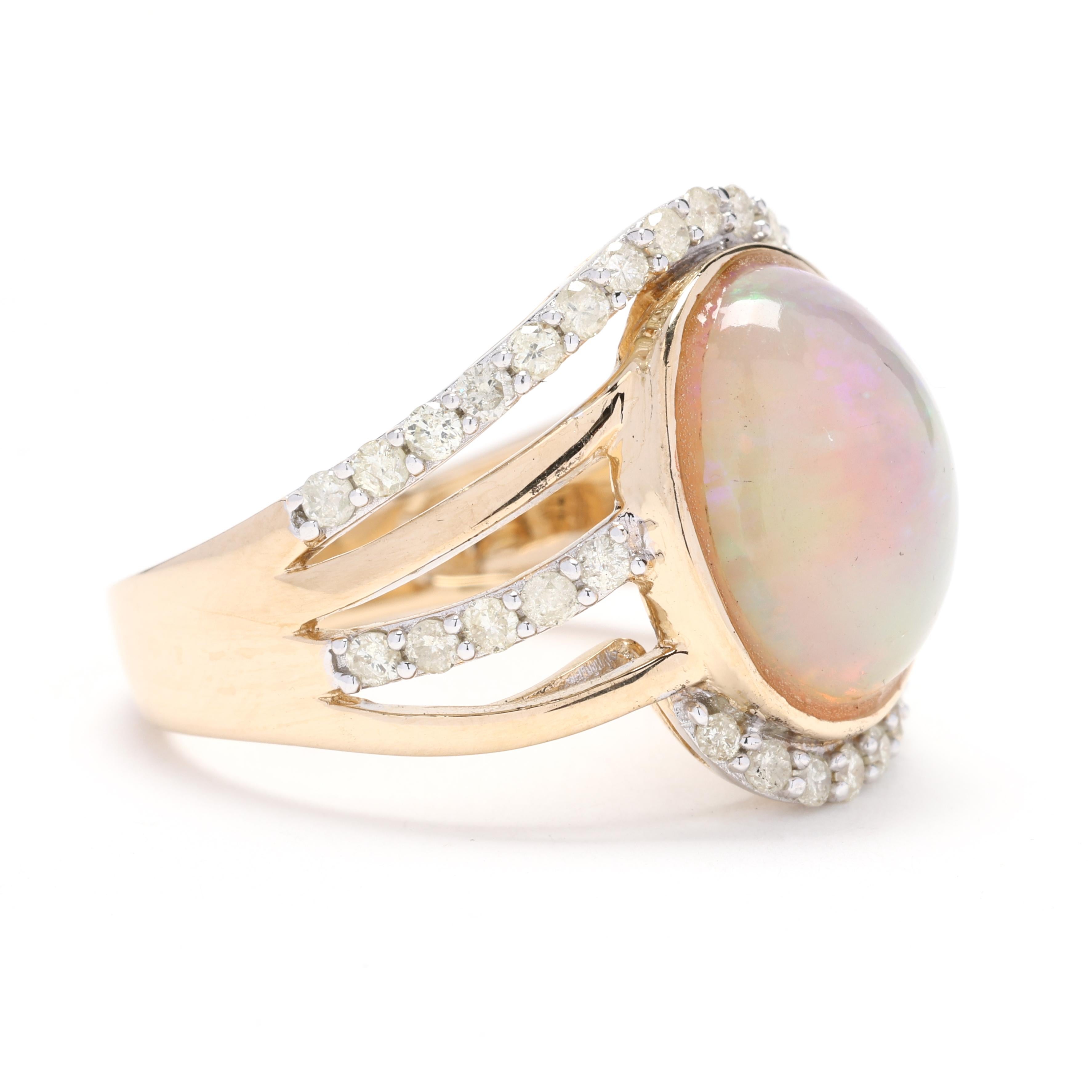 Discover the enchanting elegance of our Orianne Diamond and Opal Statement Ring, meticulously crafted in luxurious 14k yellow gold. This exquisite piece, available in ring size 7, features a mesmerizing opal centerpiece that captures the essence of