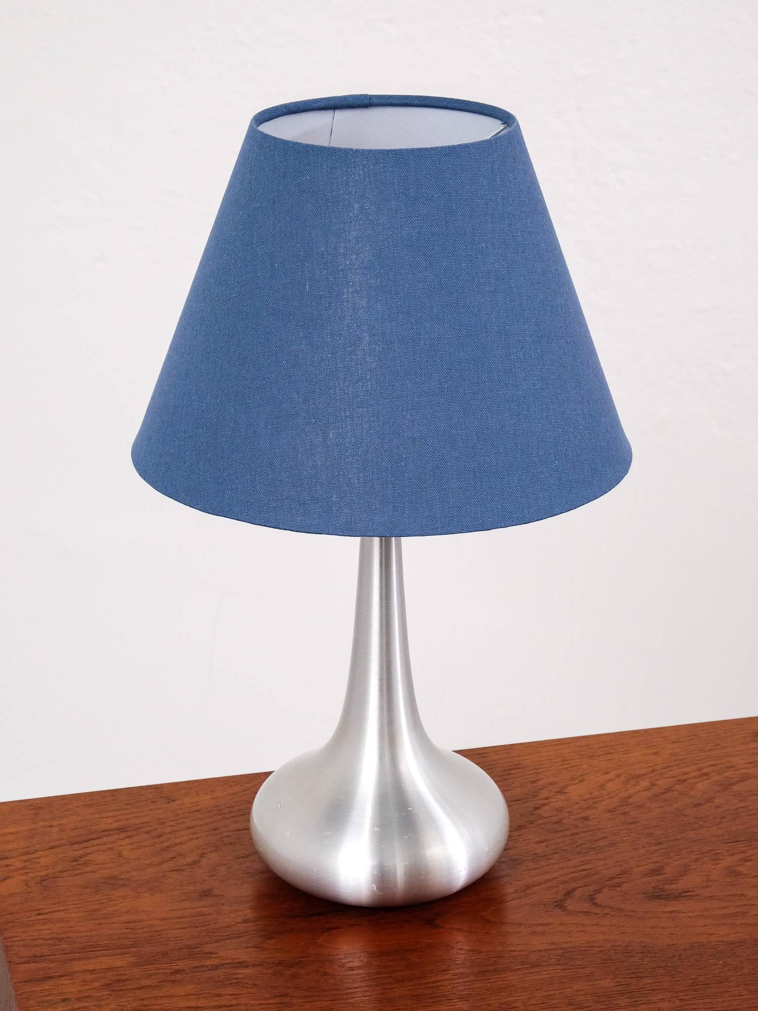 'Orient' table lamp was designed by Jo Hammerborg during the 1960s and manufactured by Fog & Mørup in Denmark. This is the 'Mini' version. The lamp body is made from aluminium. Comes with a new shade. It remains in a good vintage condition with a