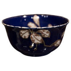 Oriental Blue Porcelain Cup with White Floral Motifs