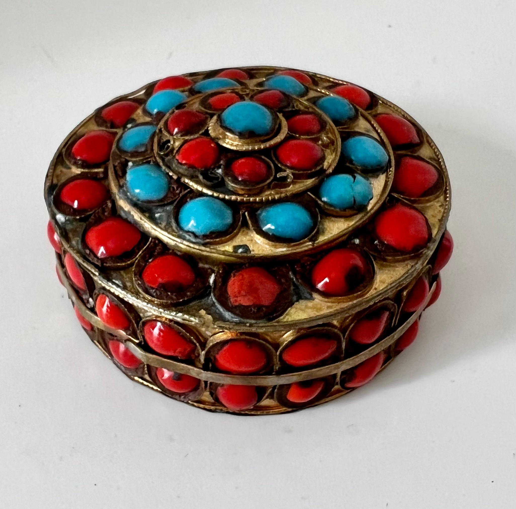 Vibrant and bold multi-color Beaded box.  The bead colors and arrangement makes the piece a fine decorative piece.

A compliment to many settings, on a desk or work station to hold everything from paper clips to 420.
A pill box or stash box... or