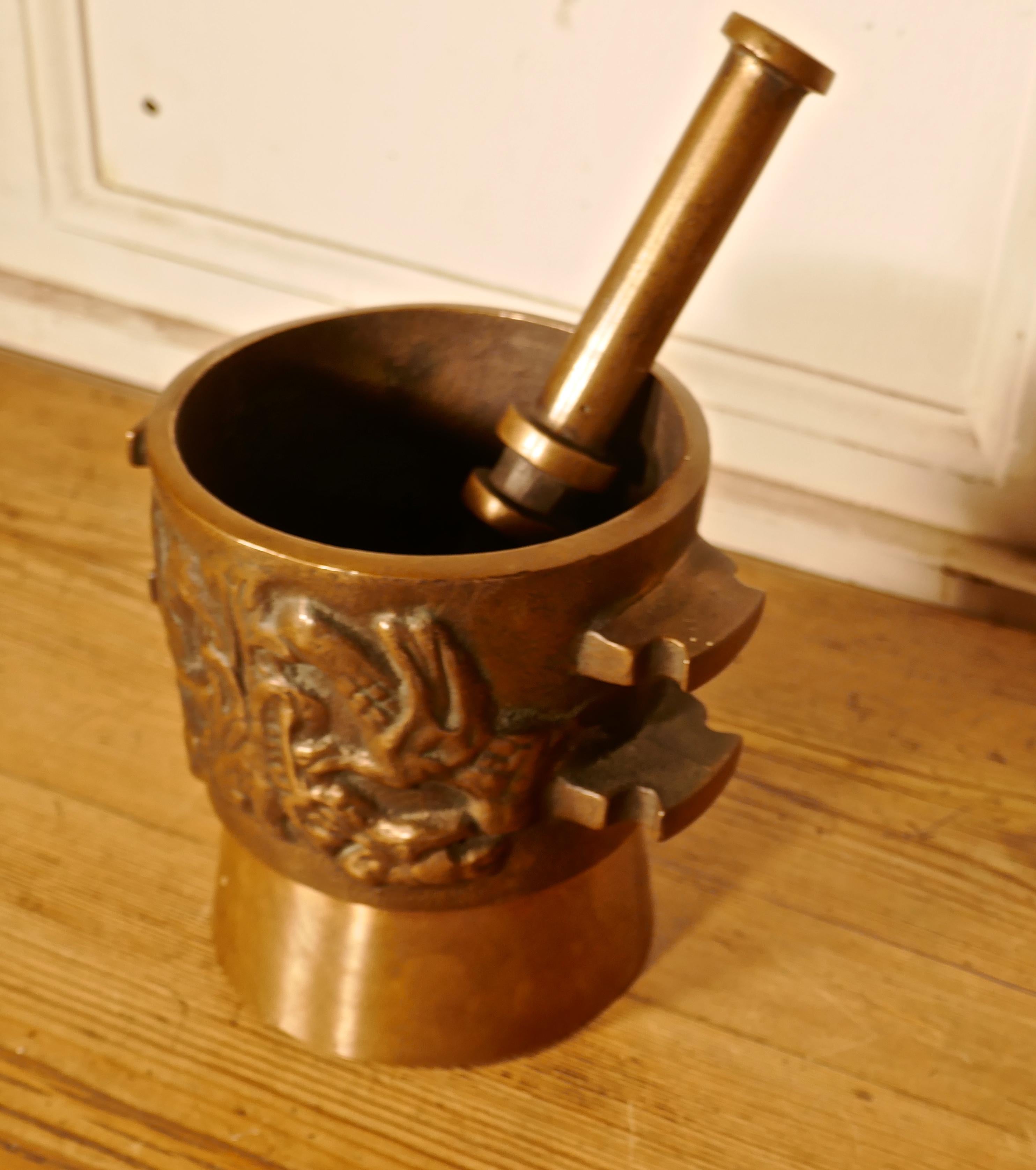 Oriental bronze pestle and mortar 

An unusual pair probably made for the preparation of herbal treatments rather than for culinary use The mortar is clean inside so it could be used in your kitchen, this is a very heavy pair, the bronze is