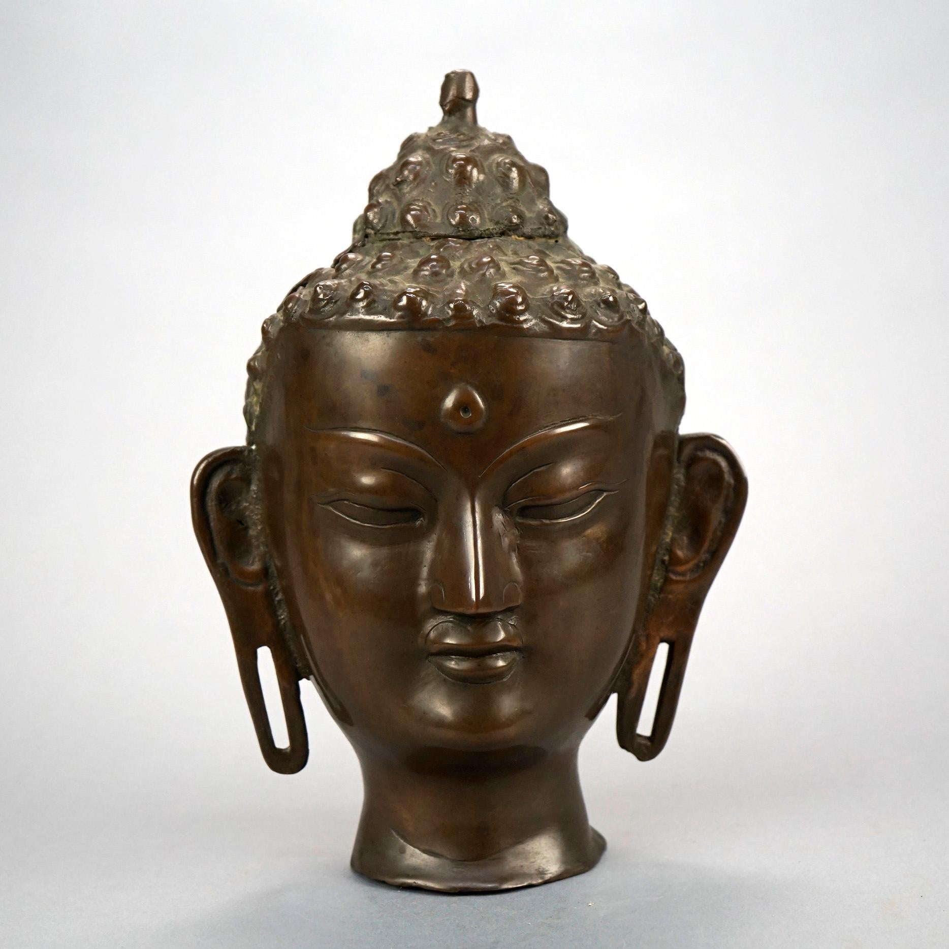 An Asian cast bronze figural sculpture of a Shiva bust, 20th century

Measures- 10.75'' H x 7.5'' W x 6'' D.

Catalogue Note: Ask about DISCOUNTED DELIVERY RATES available to most regions within 1,500 miles of New York.