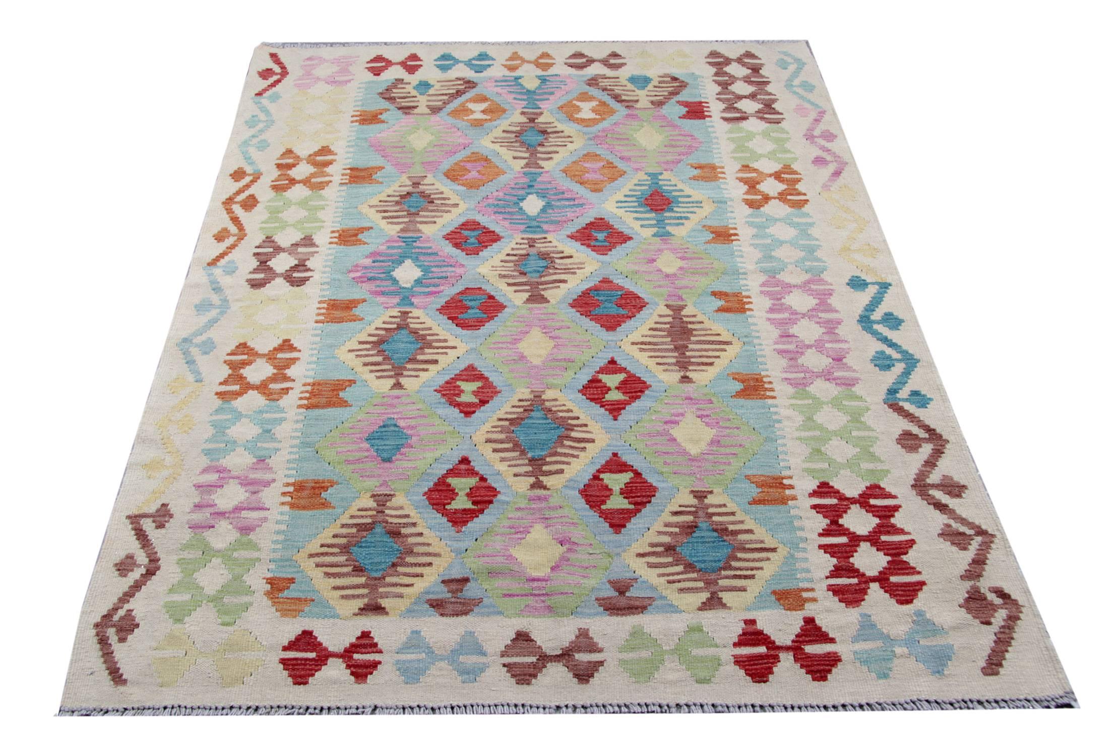 The flat wave rug shows a tribal rug design deriving from the tribes. The geometric rug has been handmade in the North of Afghanistan by Uzbek and Turkmen tribes by using local wool and cotton. The quality of the woven rug is enhanced by using only