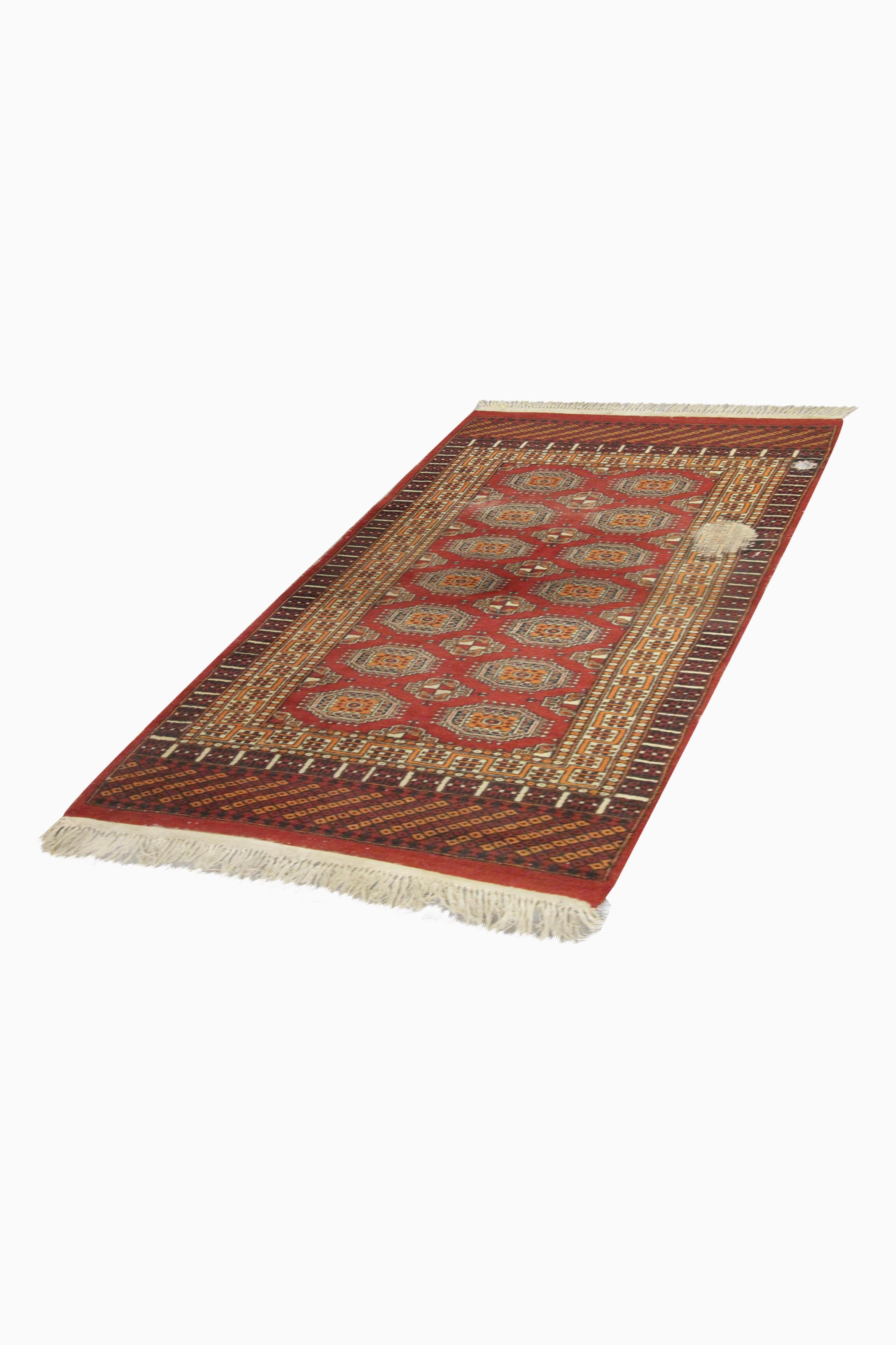 This beautiful red area rug is a fine example of handwoven Oriental rugs woven in the mid 20th century. The central design has been woven on a rich red background with black and beige accents that make up the decorative geometric design. This has