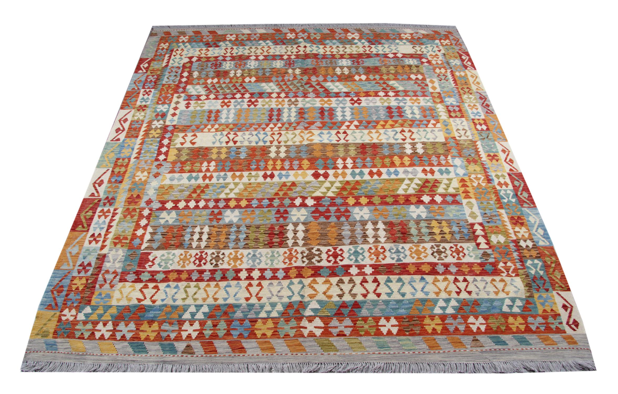 This Afghan Kilim rug is an excellent example of traditional Kilim rugs with the geometric design woven symmetrically with various vibrant and muted color pallets. These rugs were woven with traditional techniques on looms in Afghanistan.