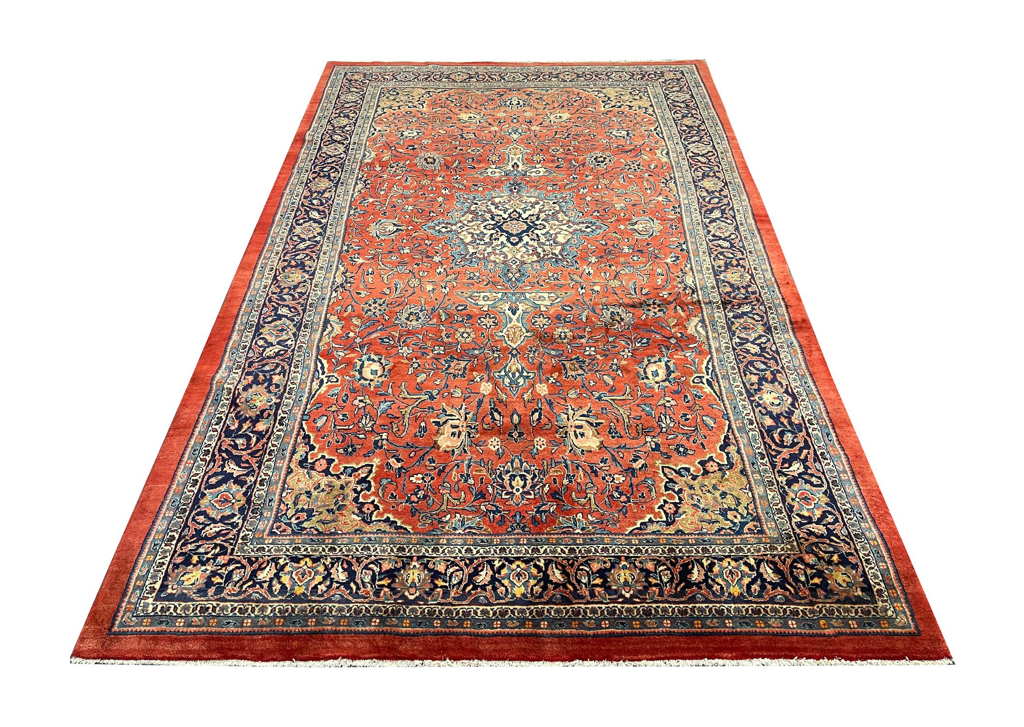 This elegant wool rug has been decorated with a fantastic central medallion design with a highly-decorative surround and bored, adorned with floral motifs that have been symmetrically woven with a high level of detail. Red, Rust, yellow and brown
