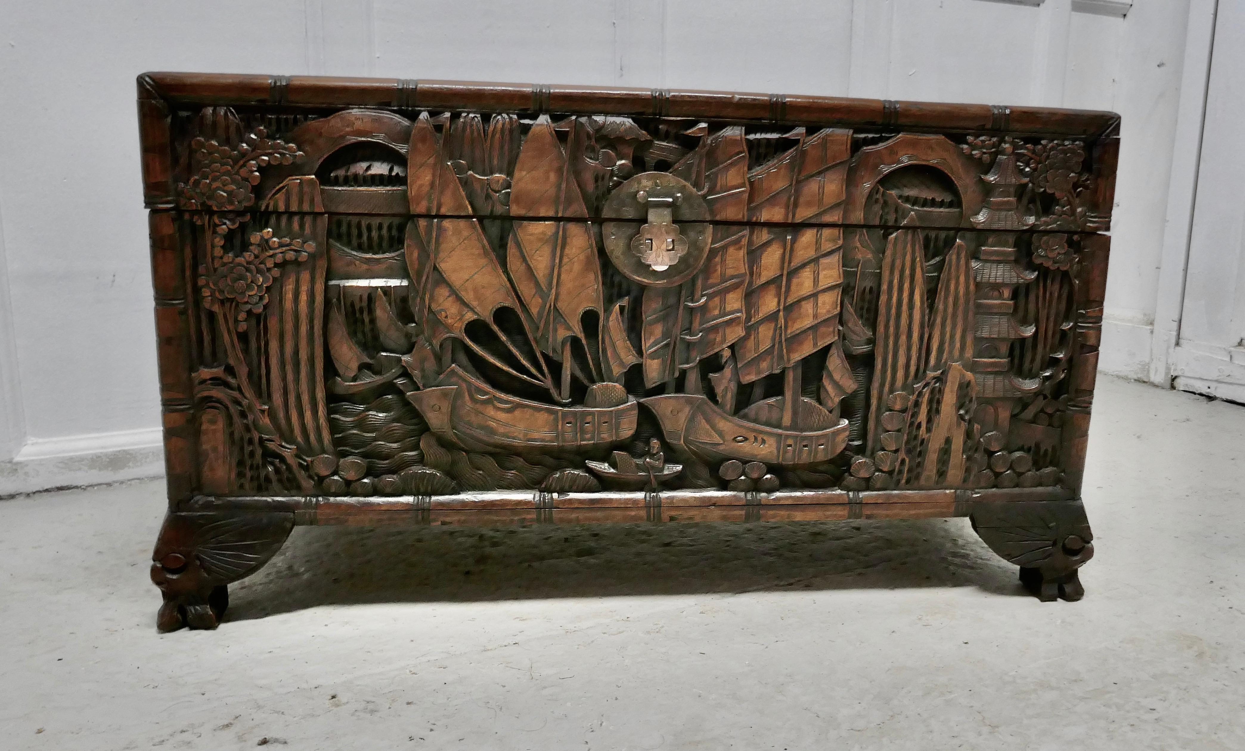 Oriental carved Camphor wood chest

This beautiful carved chest is made from Camphor wood, for those of you who do not know camphor wood it looks a lot like Mahogany it is a hard wood which lends itself very well to carving.

However the main