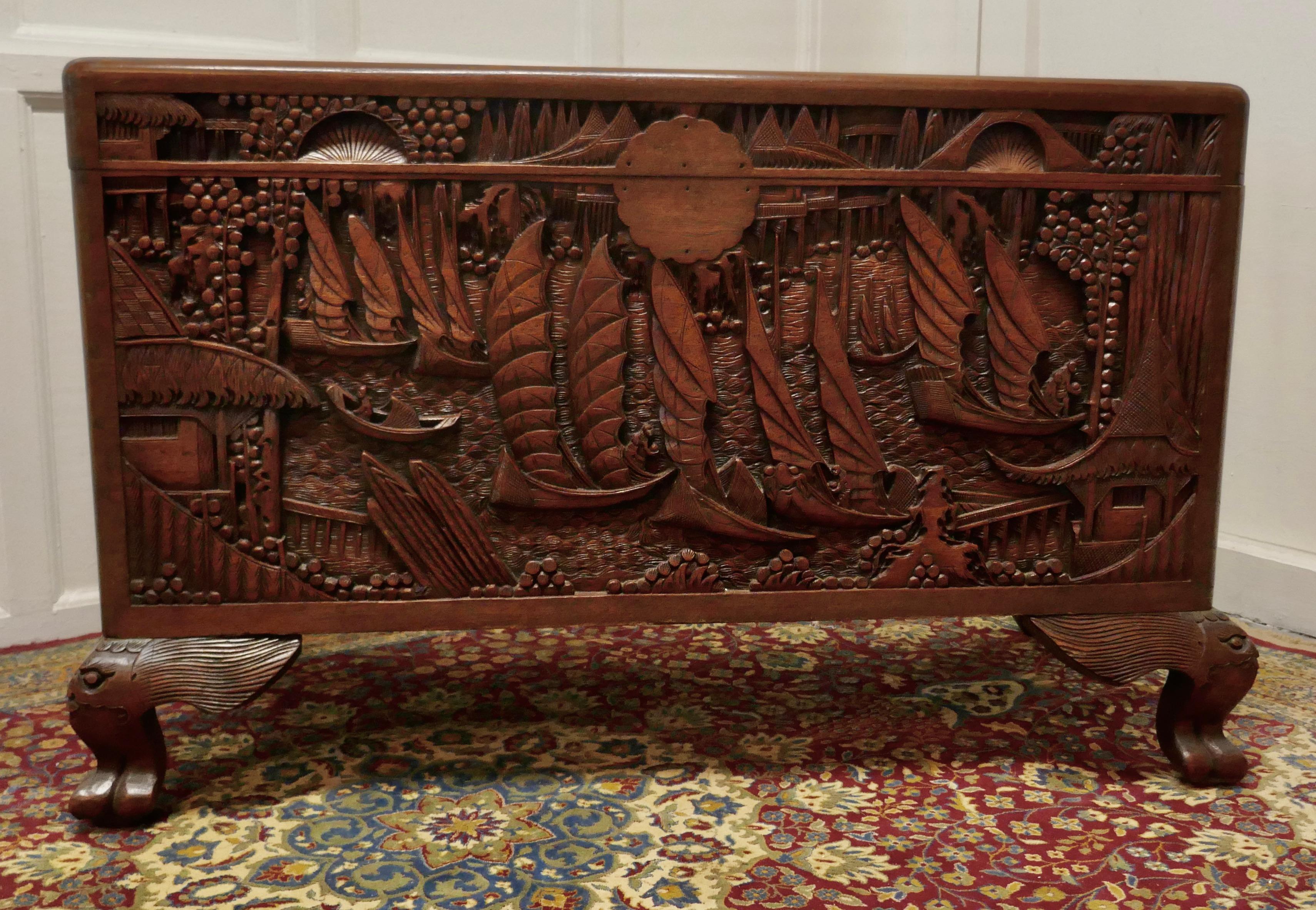 Oriental carved Camphor wood chest

This beautiful carved chest is made from Camphor Wood, for those of you who do not know camphor wood it looks a lot like Mahogany it is a hard wood which lends itself very well to carving.

However the main