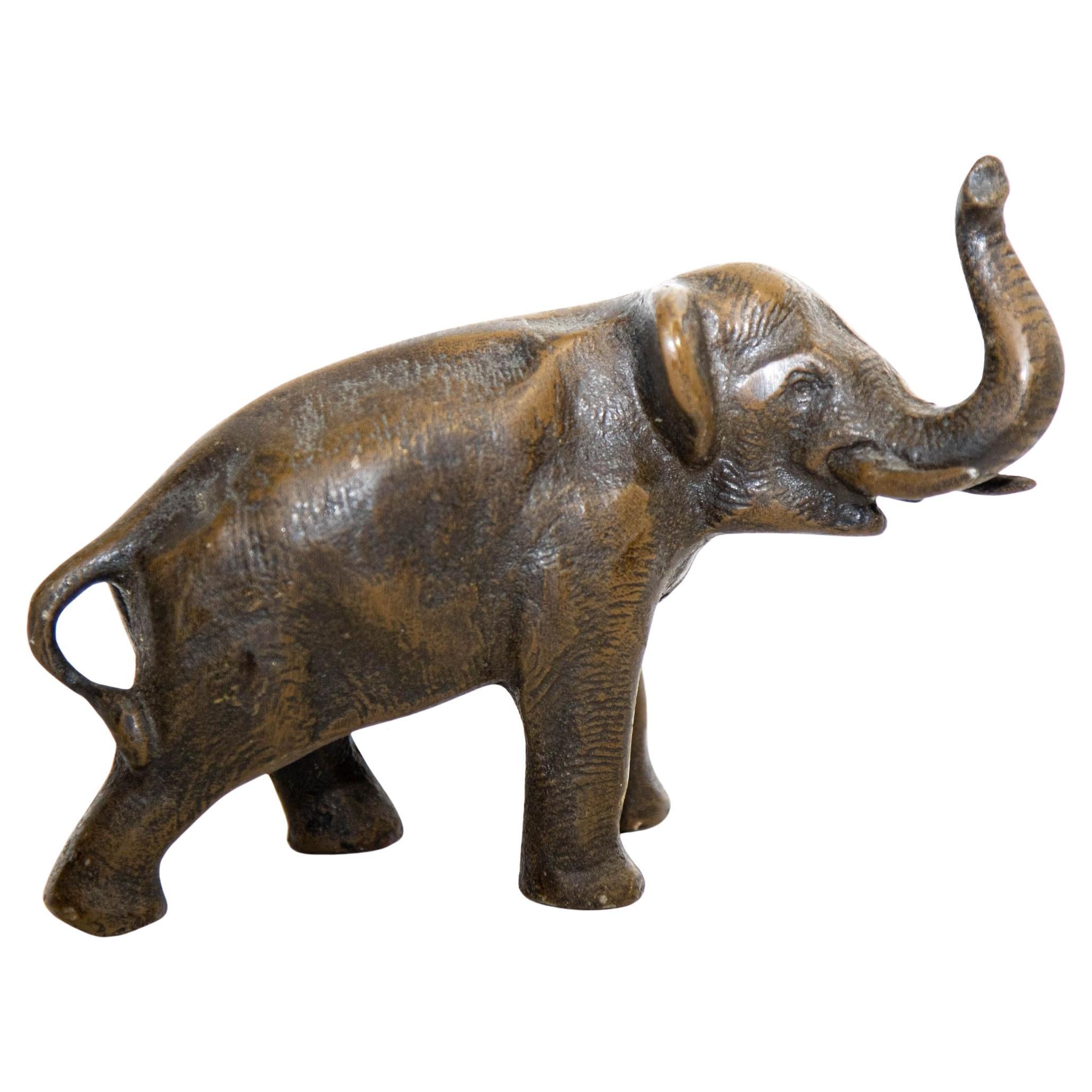 Oriental Cast Bronze Elephant Sculpture with Trunk Up For Sale