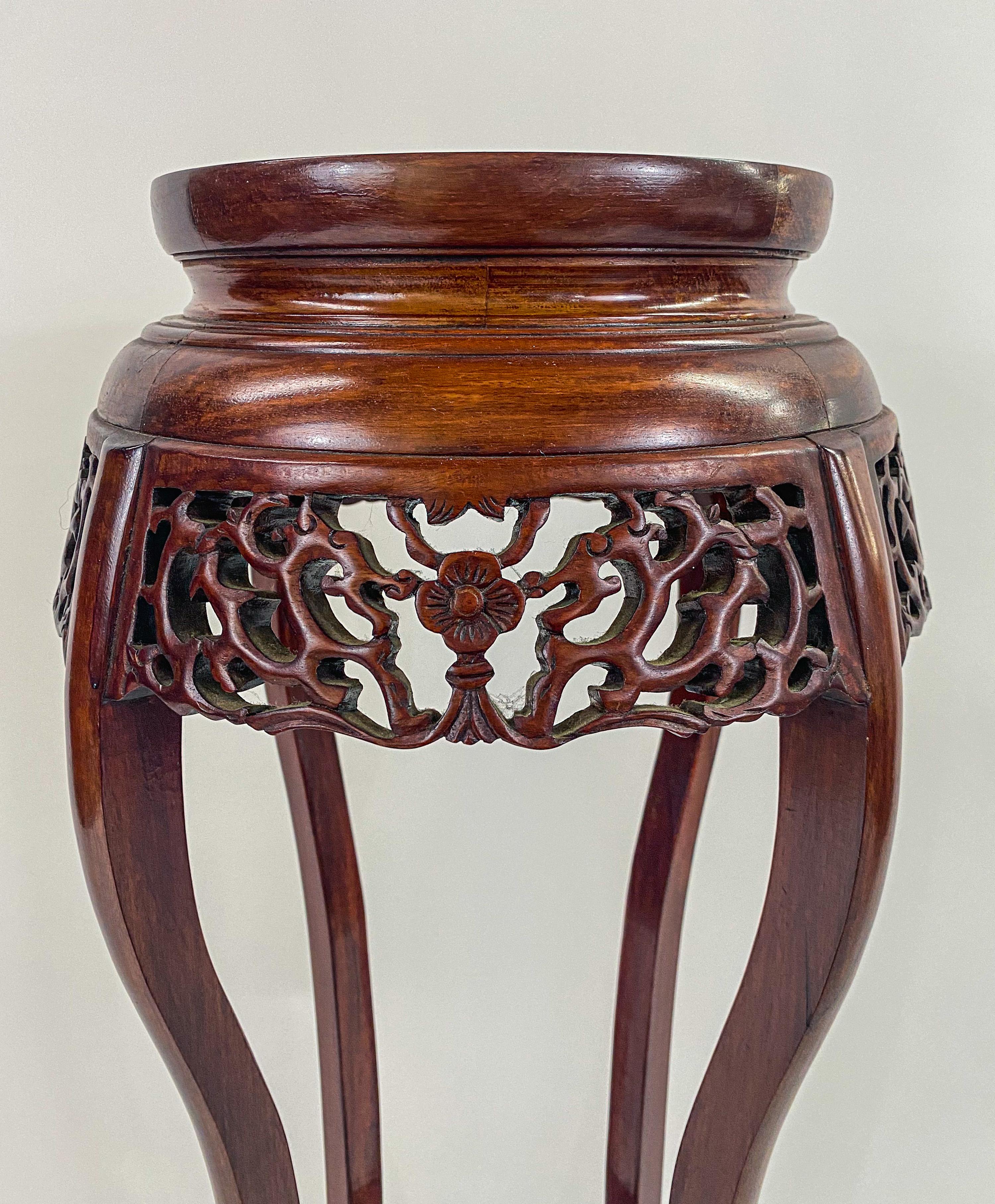 20th Century Oriental Chinese Carved Rosewood Pedestal, Plant Stand with Granite Top, a Pair 