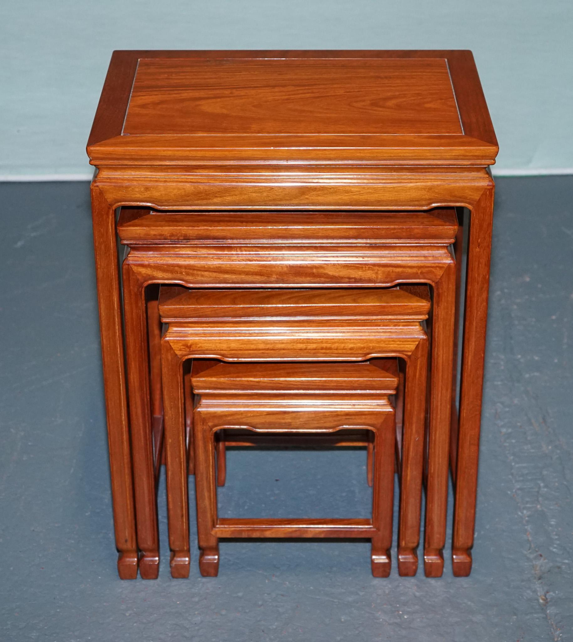 
Antiques of London



A finely crafted nest of four vintage hardwood side tables in a warm honey-toned finish, designed in an Oriental style with subtle carved detailing to the edges and legs. Each table neatly tucks beneath the next, offering a