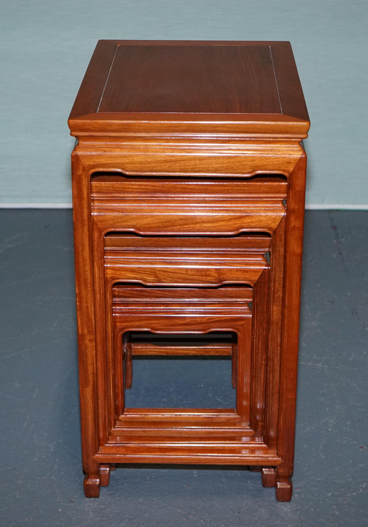 Hand-Crafted ORIENTAL CHINESE TEAK NEST OF FOUR TABLES WITH CARVED DETAiLS For Sale