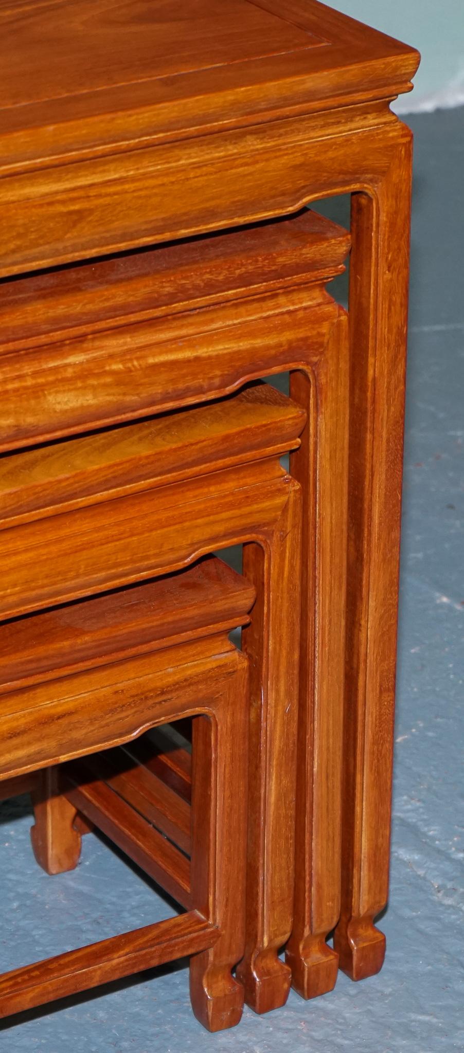 ORIENTAL CHINESE TEAK NEST OF FOUR TABLES WITH CARVED DETAiLS In Good Condition For Sale In Pulborough, GB