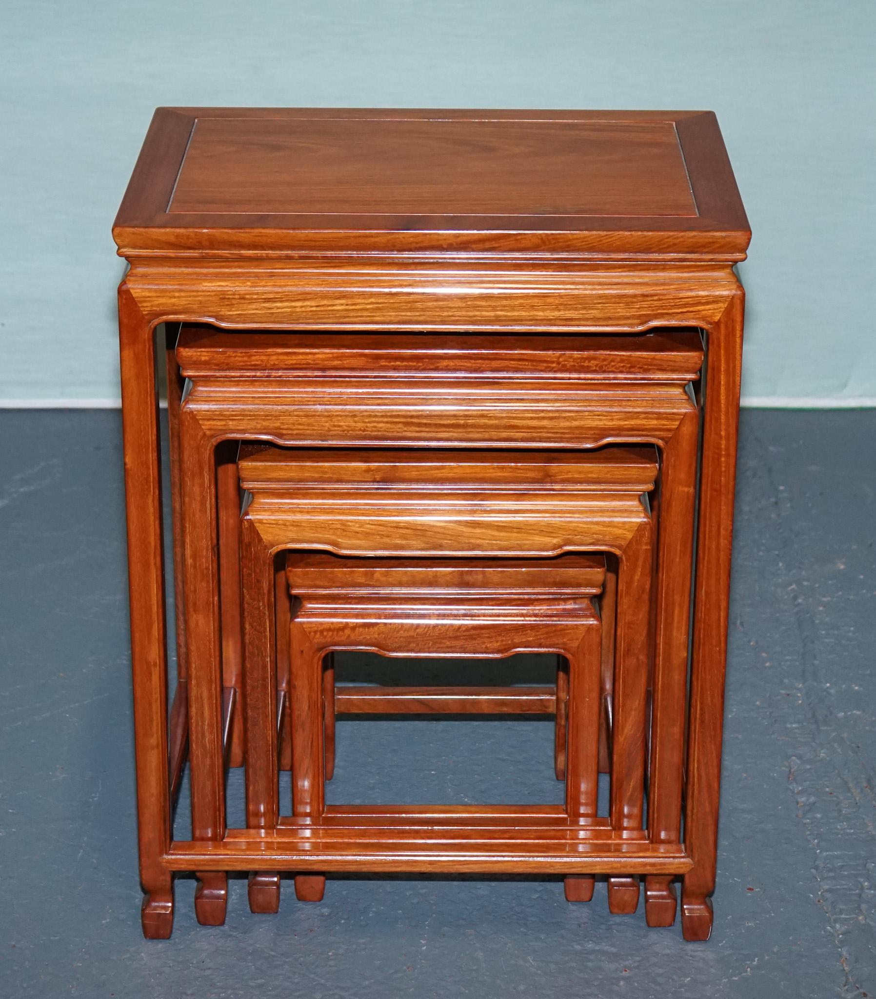 20th Century ORIENTAL CHINESE TEAK NEST OF FOUR TABLES WITH CARVED DETAiLS For Sale