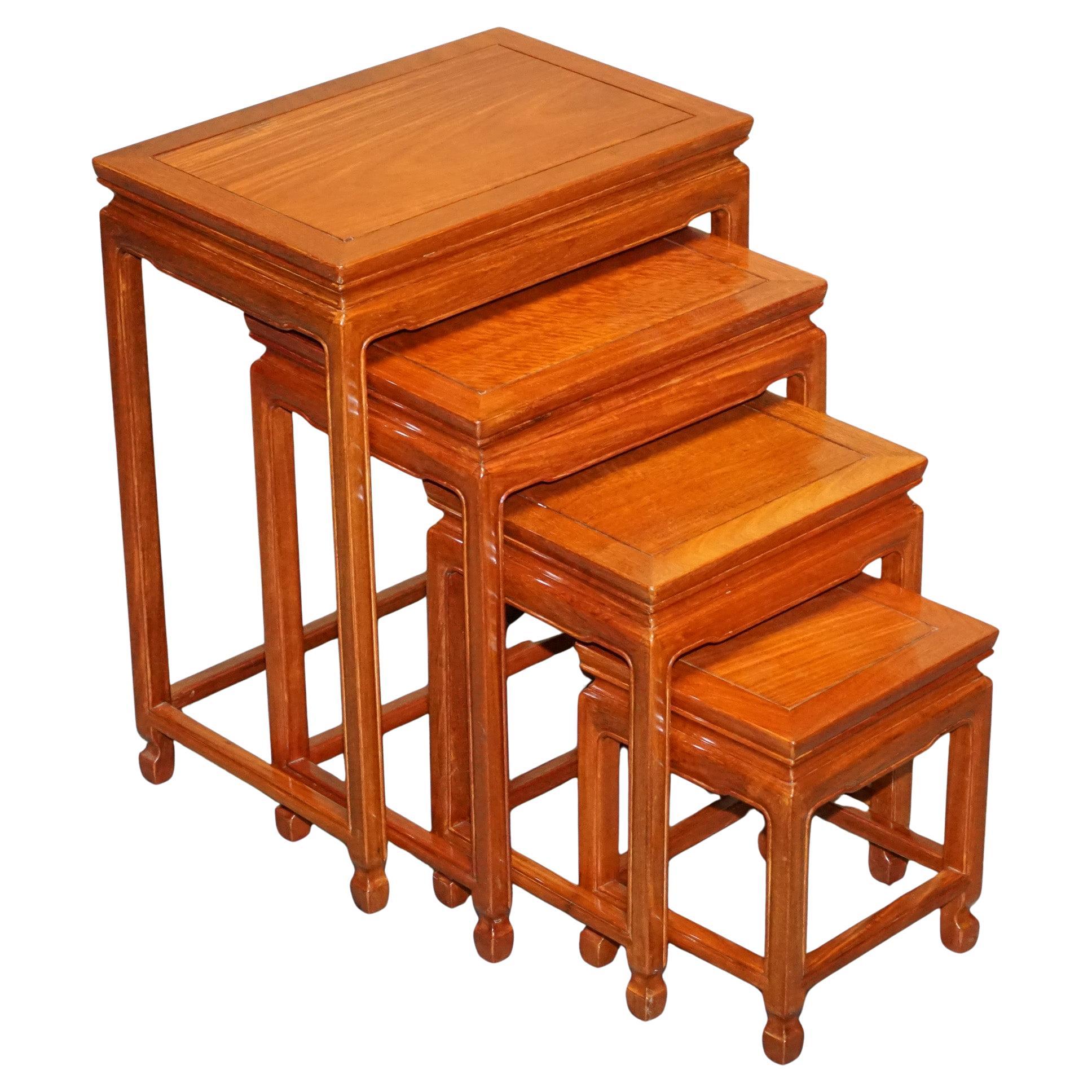 ORIENTAL CHINESE TEAK NEST OF FOUR TABLES WITH CARVED DETAiLS For Sale