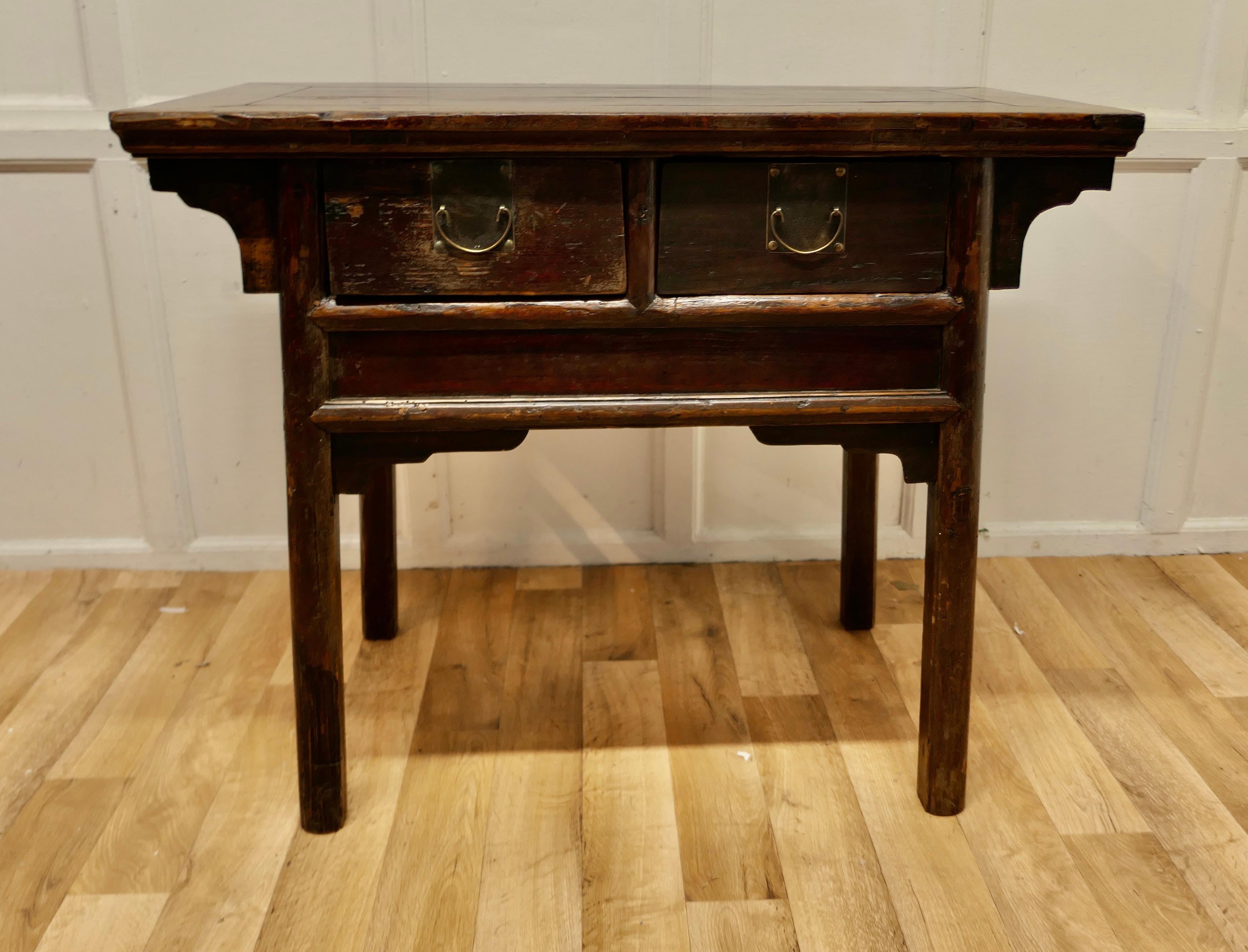 Oriental deep side table or work table 

This is a very attractive piece, the table has a broad cleated border which has superb worn patina where it has been lovingly polished for many years
The table has deep 2 drawers with an overhanging top