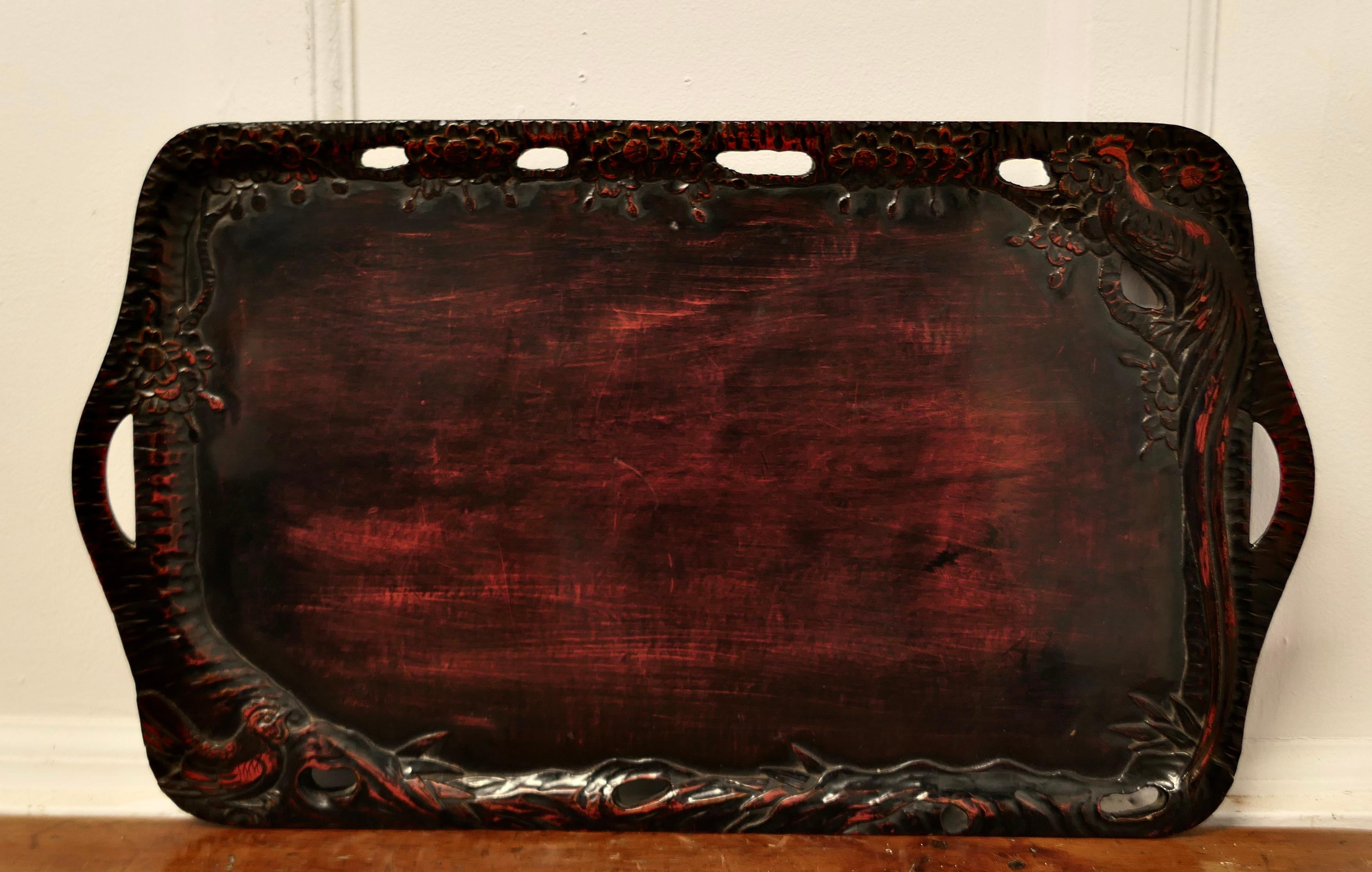 Oriental Folk Art Carved Red Lacquer Tray Decorated with Cockerels 

This is a superb piece of hand carving, the edge of the tray is in the form of a cockerels with their tails entwined all the way around
A superb piece in Black and Red lacquer with