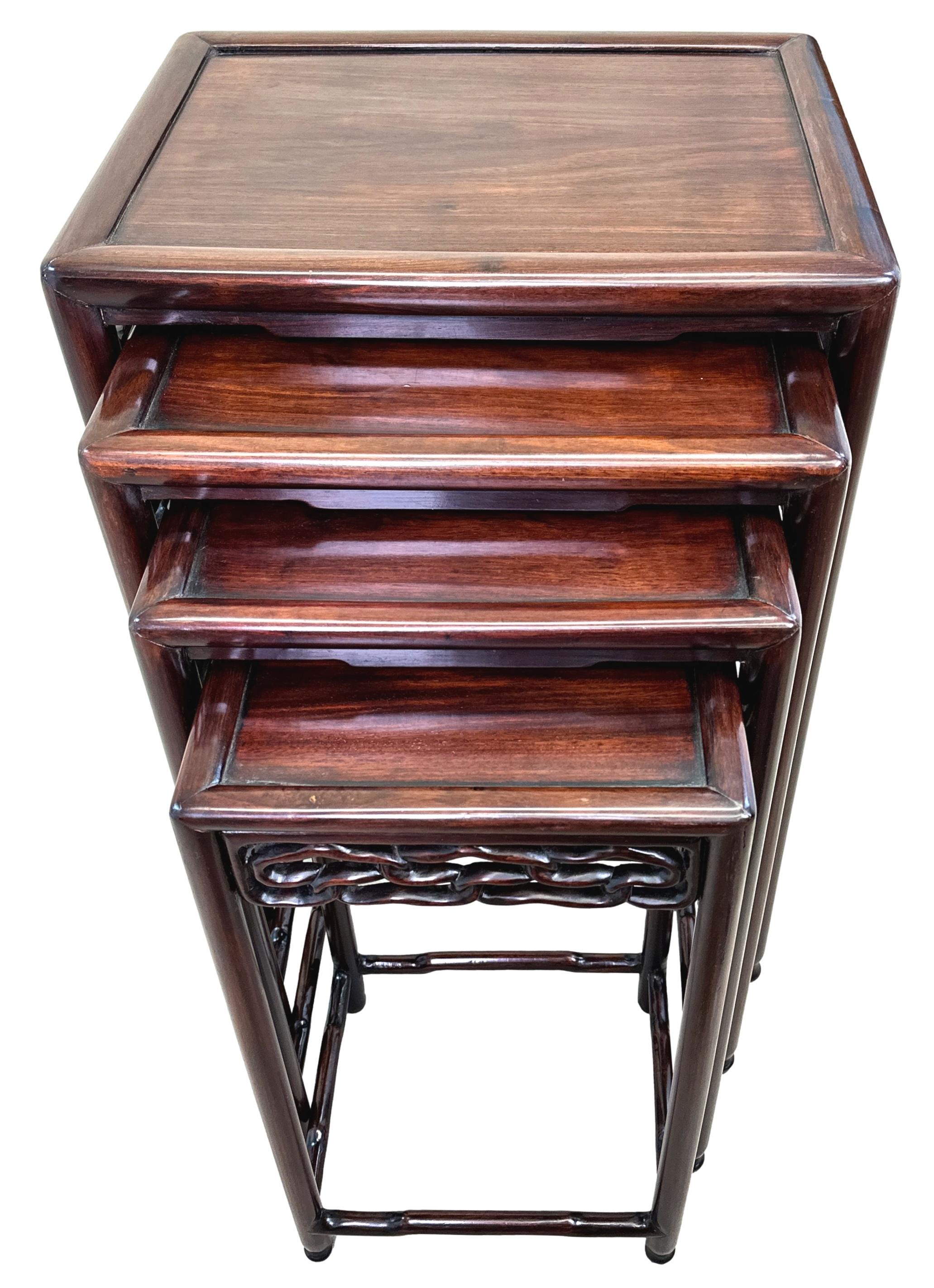 A Very Good Quality Mid 19th Century Nest of Four Oriental Hardwood Coffee Tables, Having Well Figured Panelled Tops, Retaining Good Rich Colour Throughout, Over Attractive Carved And Pierced Friezes, Raised On Elegant Turned Upright Supports.

Many