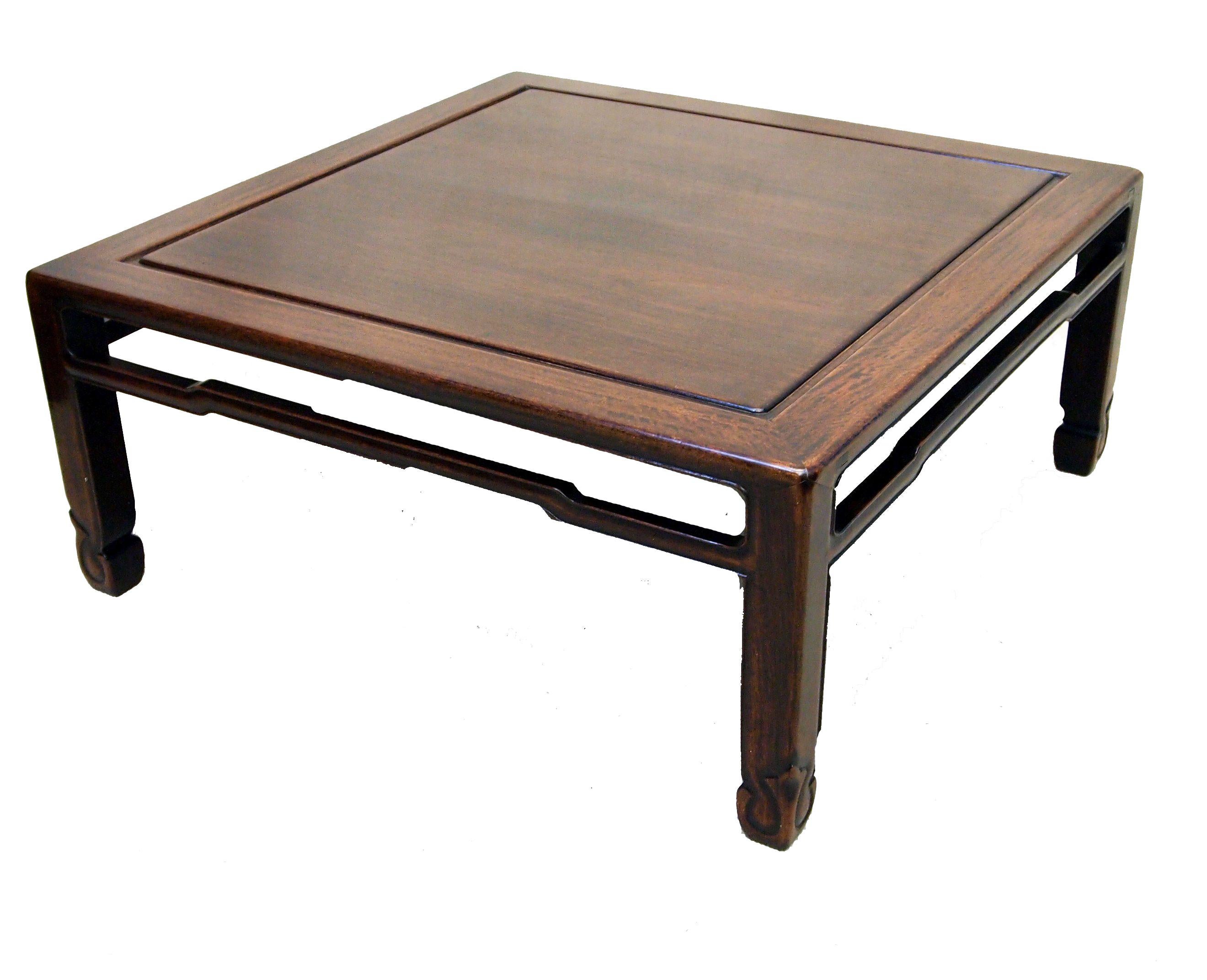 An attractive early 20th century oriental hardwood
square coffee table having figured paneled top and
moulded decoration to legs.