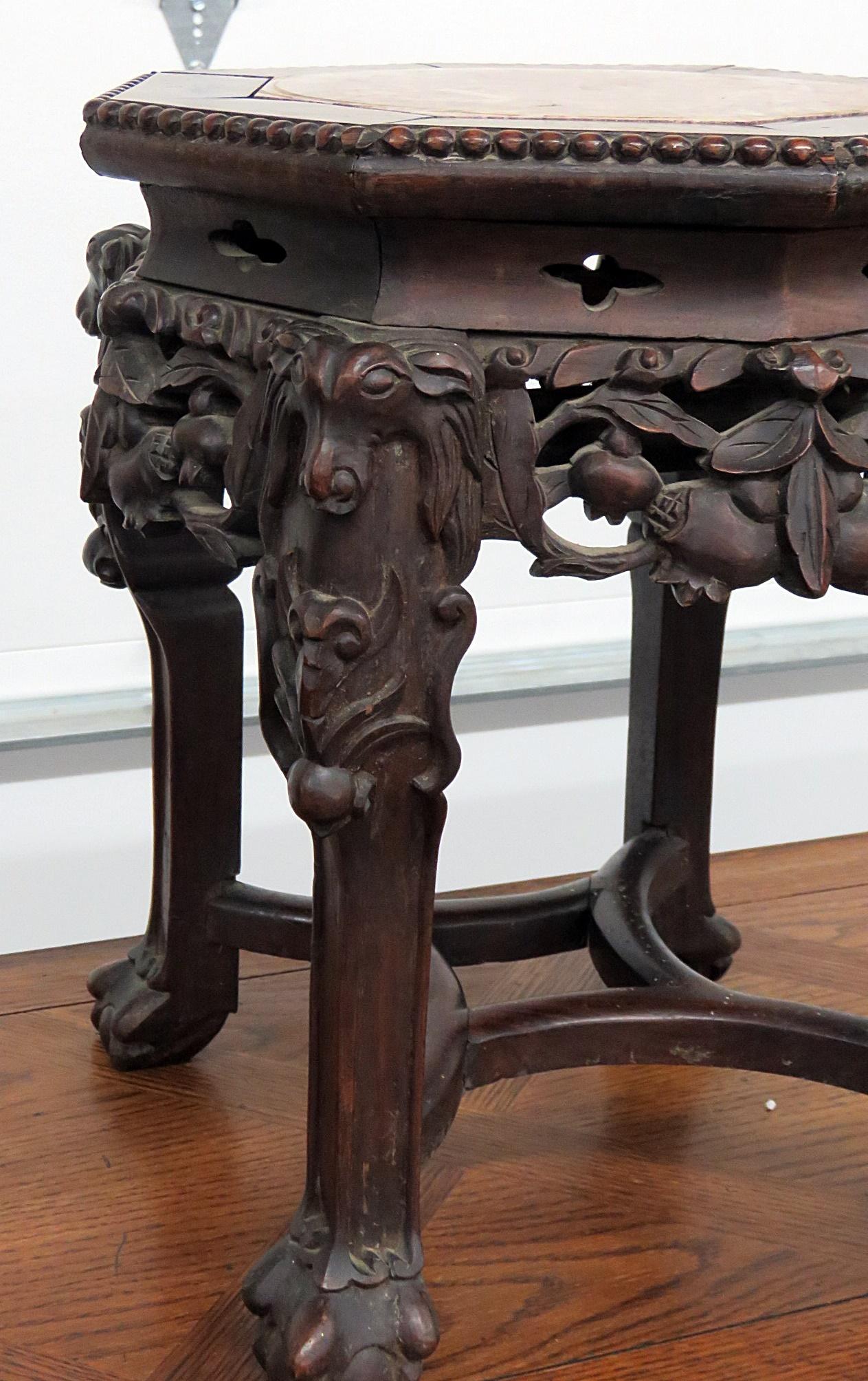 Oriental marble top tabouret stand with ball and claw feet.