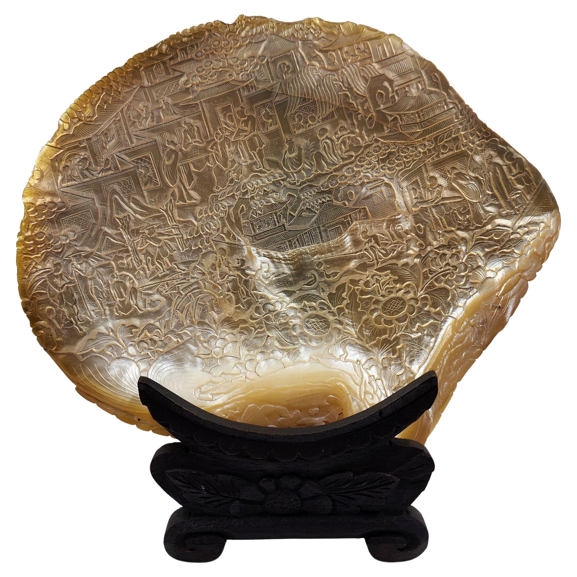 Oriental mother-of-pearl shell carved in low relief