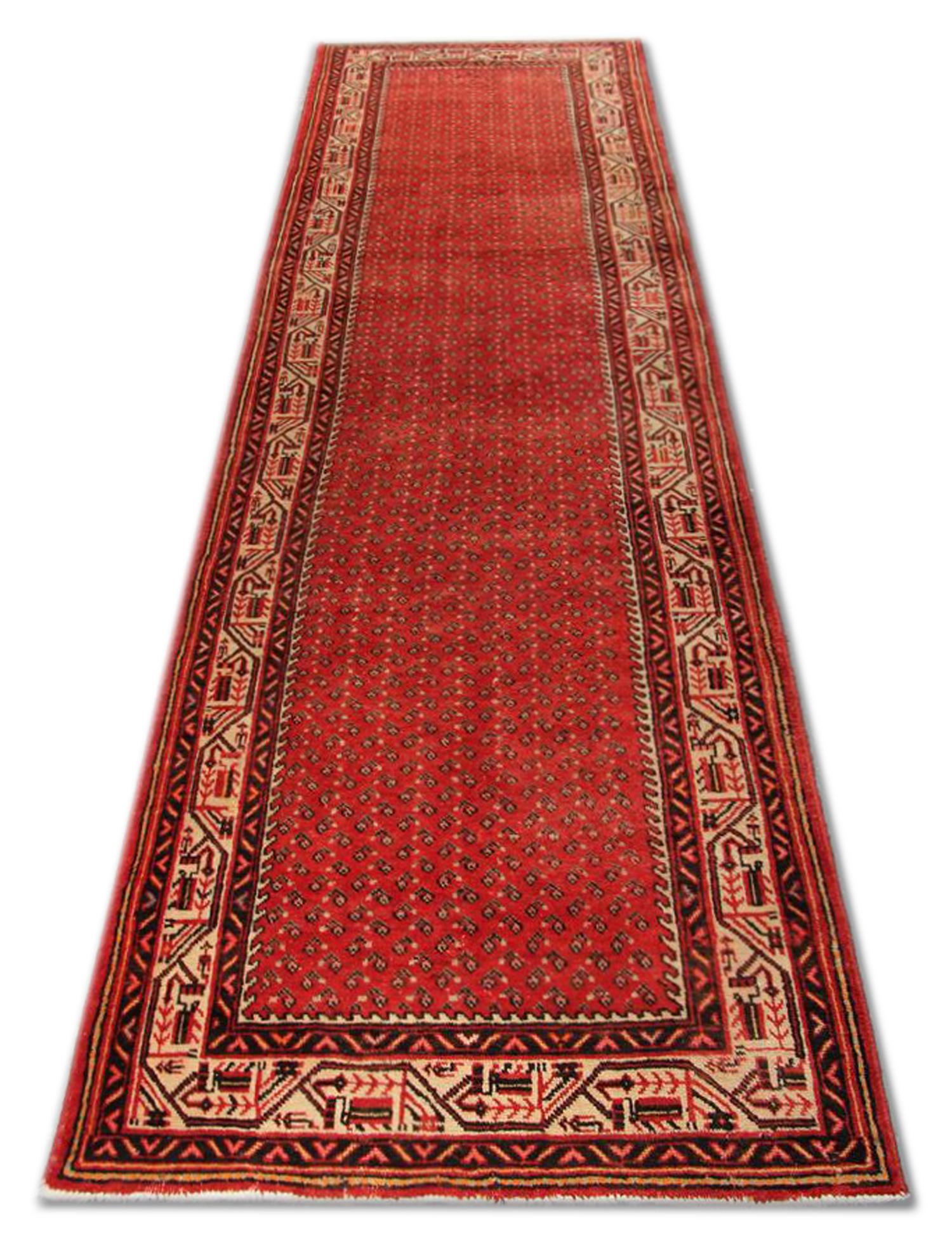 Looking to upgrade your floors with a Vintage Rug? This piece is sure to wow your guests…
This truly unique Runner rug has been hand-woven with a highly detailed symmetrical, tribal motif design. Featuring a simple red cream colour palette that